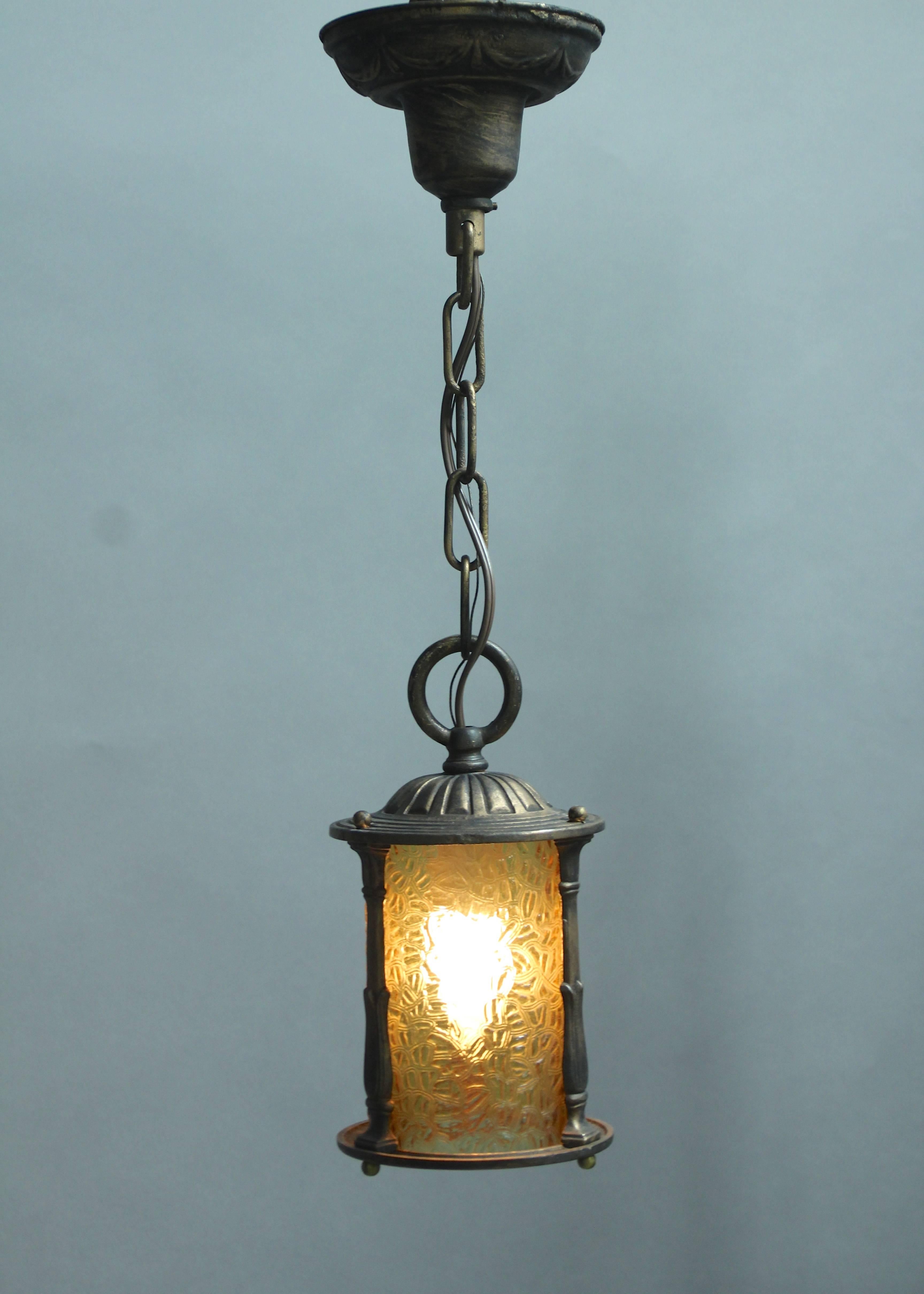 Bronze color pendant circa 1920s with original glass insert. Measures are 10.25