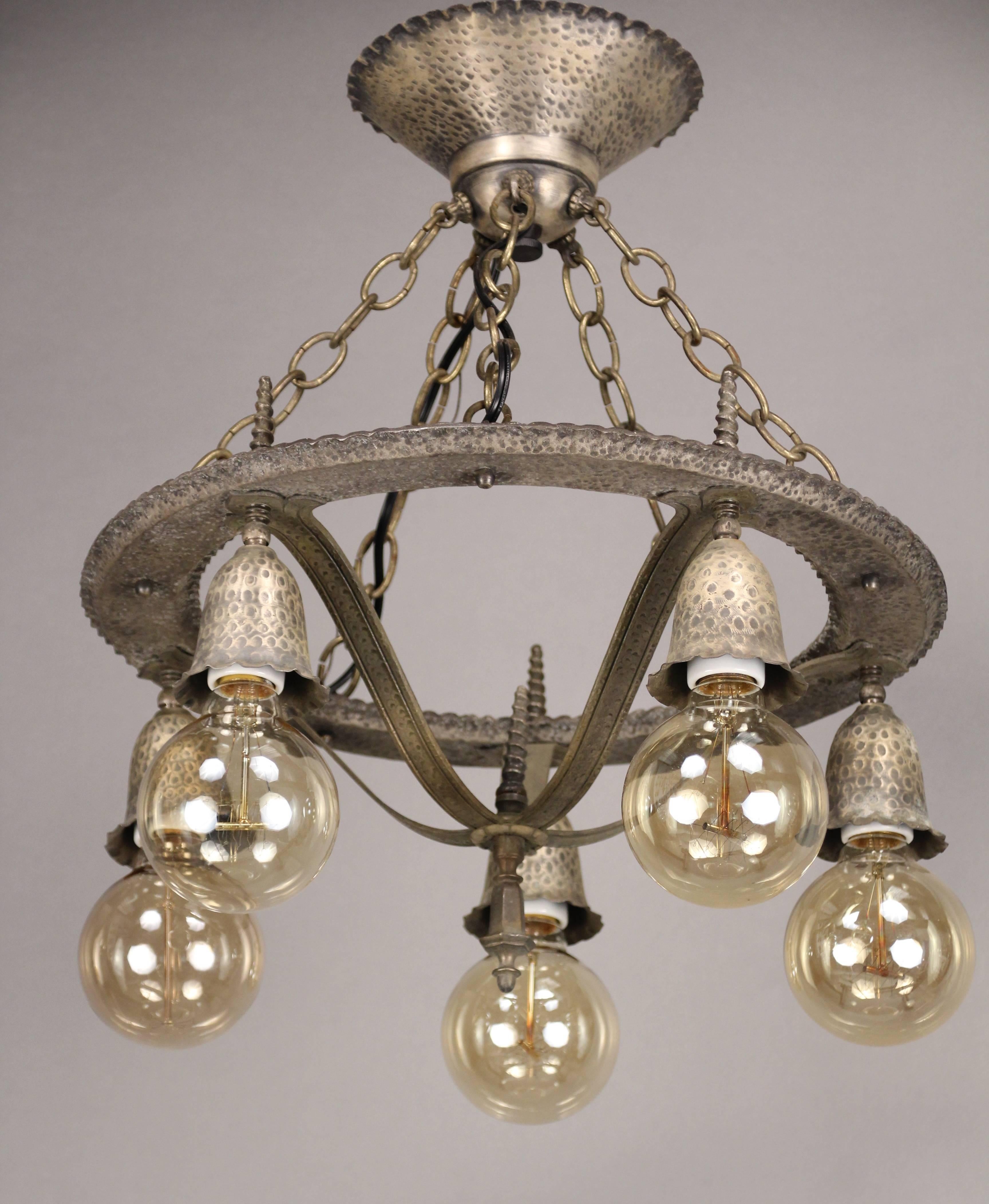 Downlight chandelier with pewter colored finish. This dates to the 1920s and fits nicely in Tudor, Arts & Crafts and Spanish decor. Measures: 19