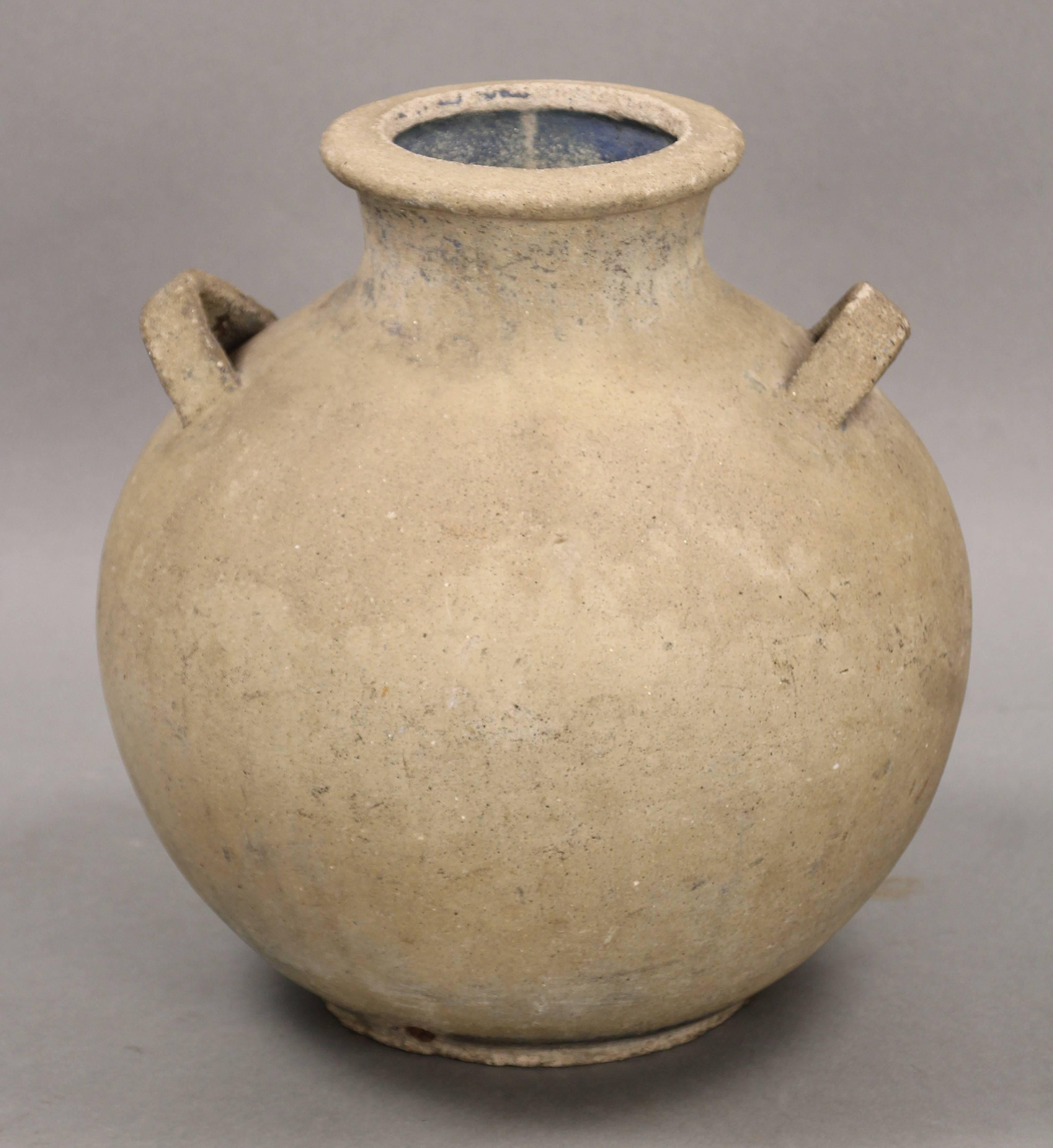 Simple spherical form with lobed handles with smooth surface and earthy coloring. Small chip on base. Hillside Pottery was an important manufacturer in Los Angeles in the 1920s and is now very sought after by collectors of Spanish Revival items.