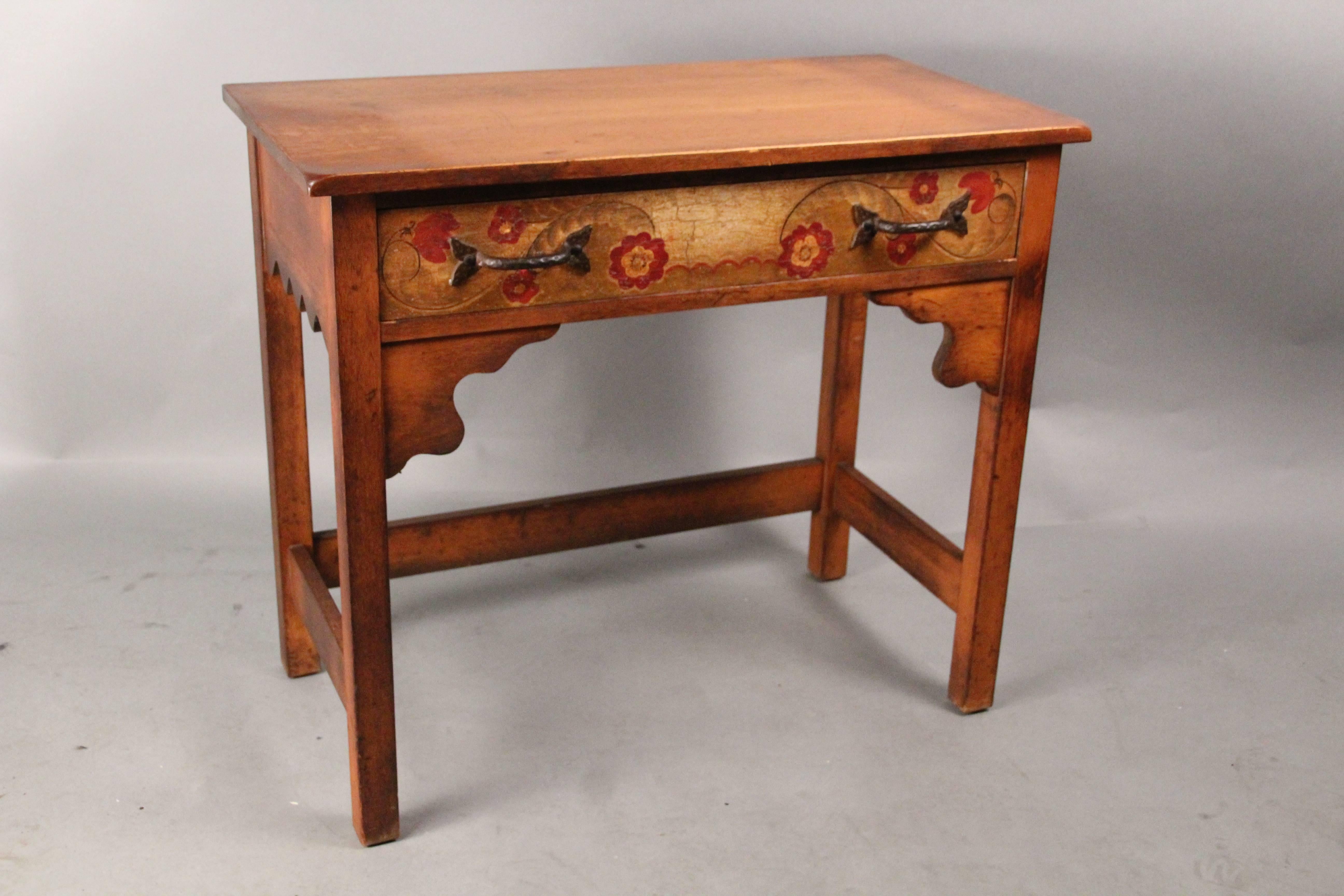 Monterey side table with one drawer, circa 1930s. Iron pull. Colorful hand-painted floral decoration.