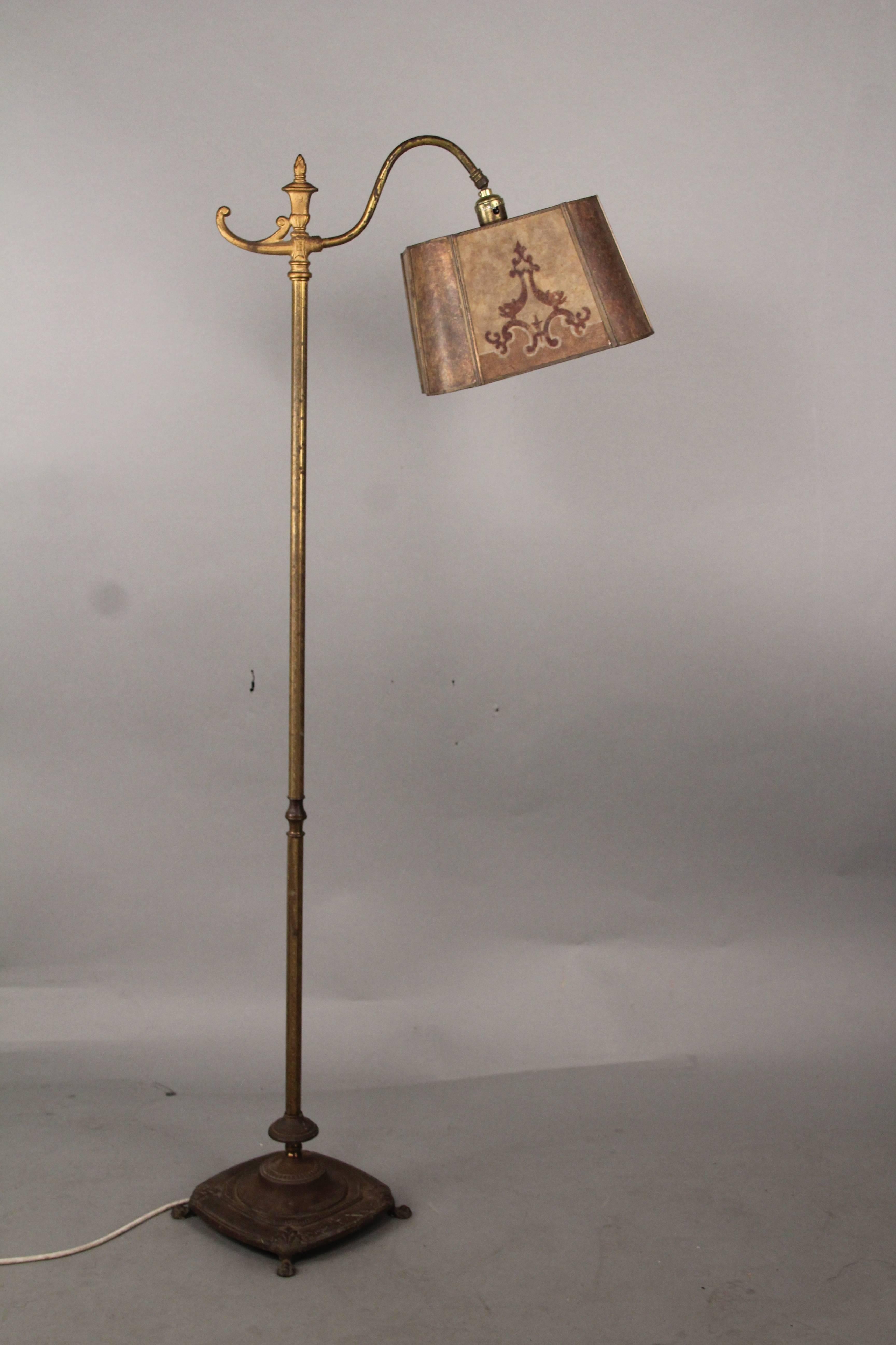 Very nice floor lamp with adjustable shade. Shade is in good condition and his beautiful when it lights up. Would fit nicely in a Tudor, Arts & Crafts or Spanish Revival Home. Measures: 52
