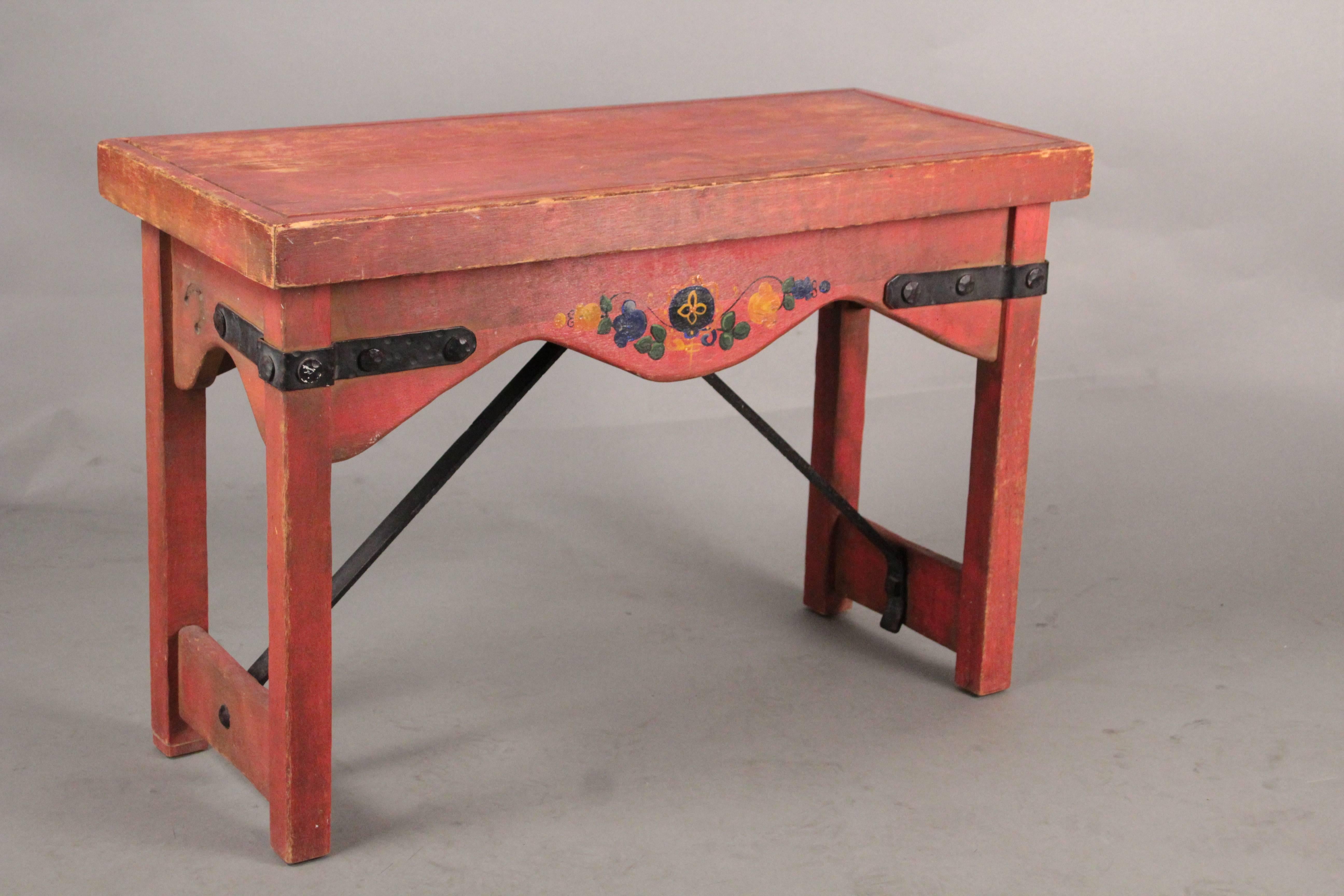 Old red California signed Monterey bench with iron stretcher and hand floral painting, circa 1930s. Original finish. Measures: 21.75