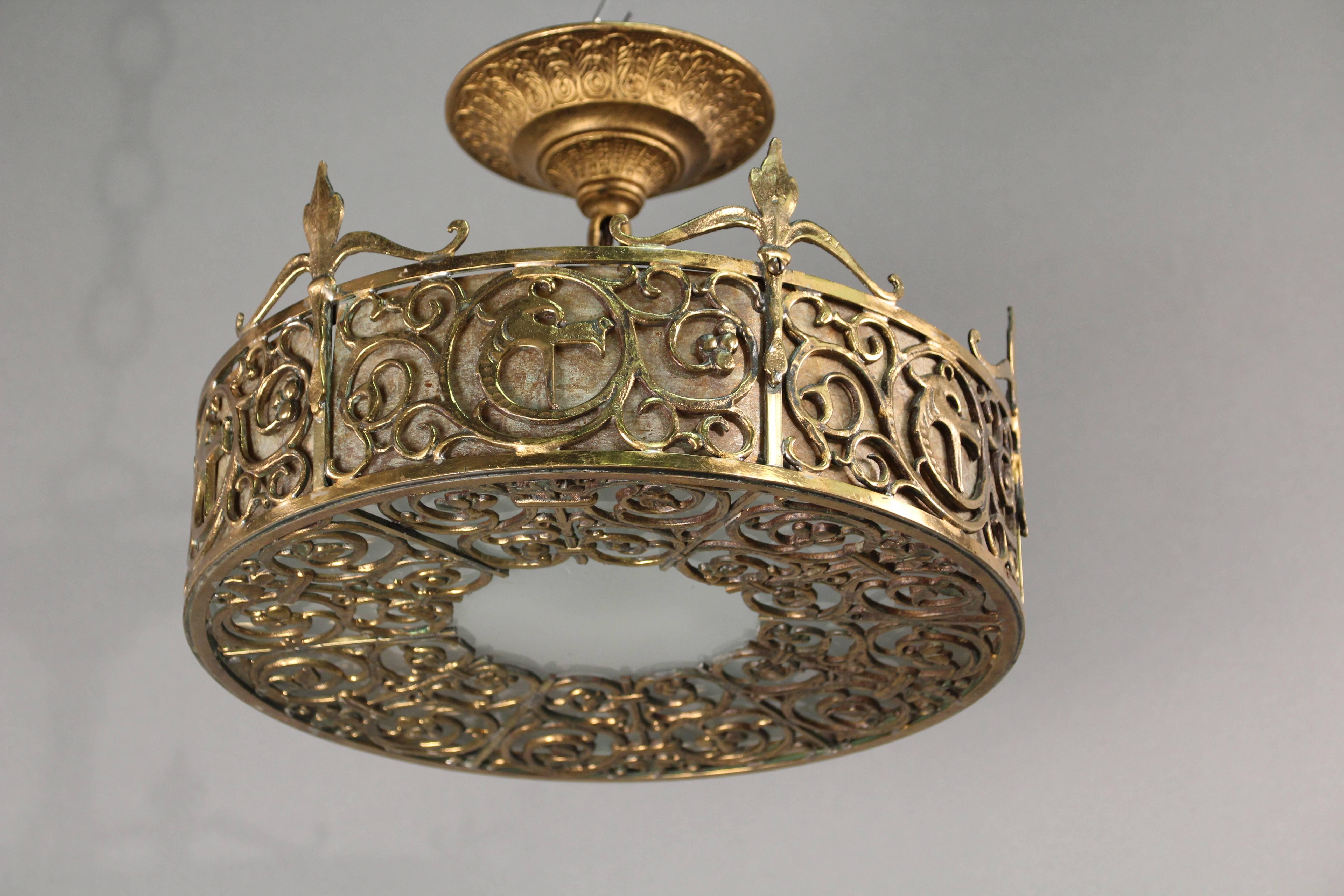 Bronze ceiling mount attributed to Oscar Bach with dragon heads, circa 1920s. Bronze, glass and mica.