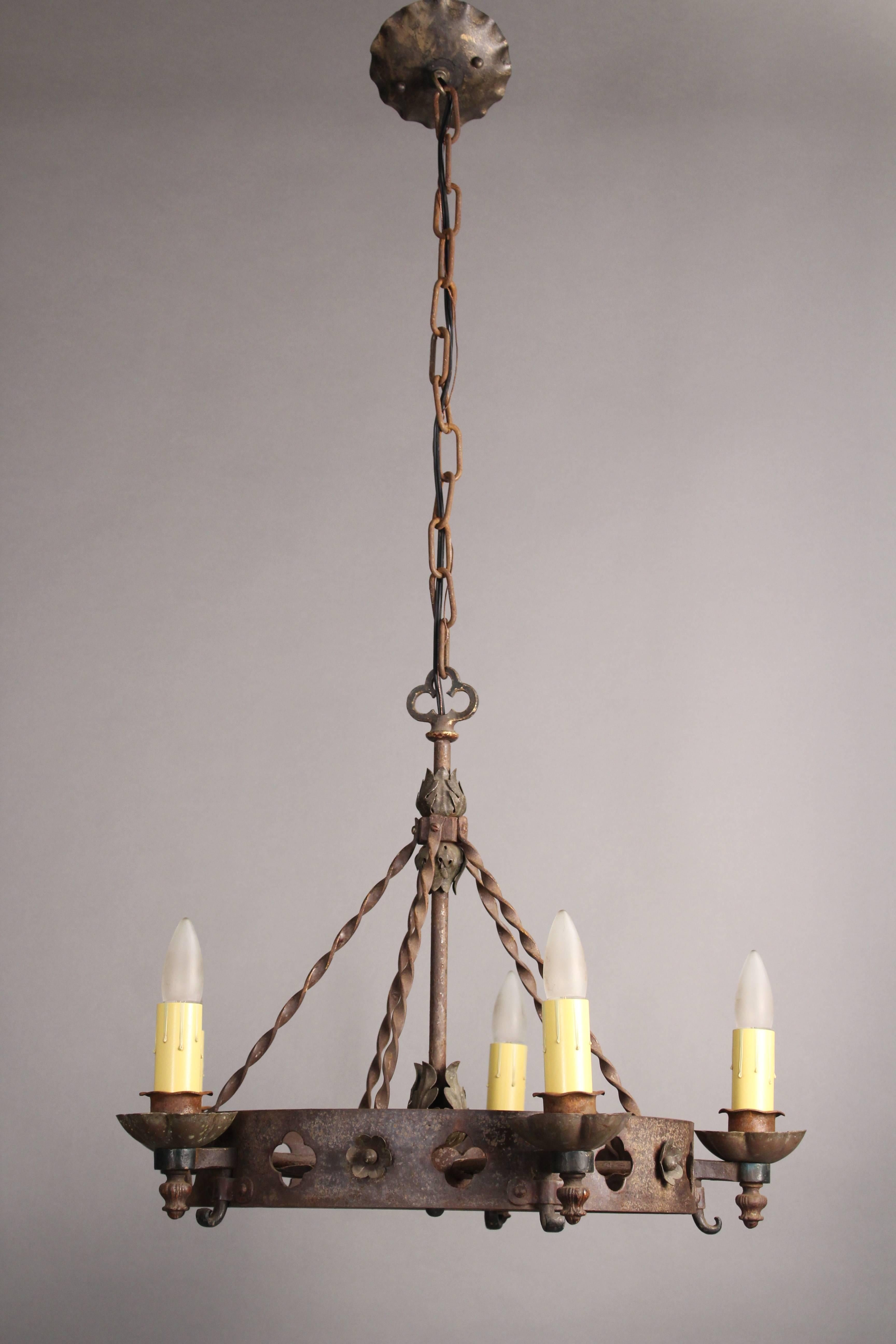 Iron chandelier with clover cut-outs, circa 1920s. Original finish. Measures: 18.25