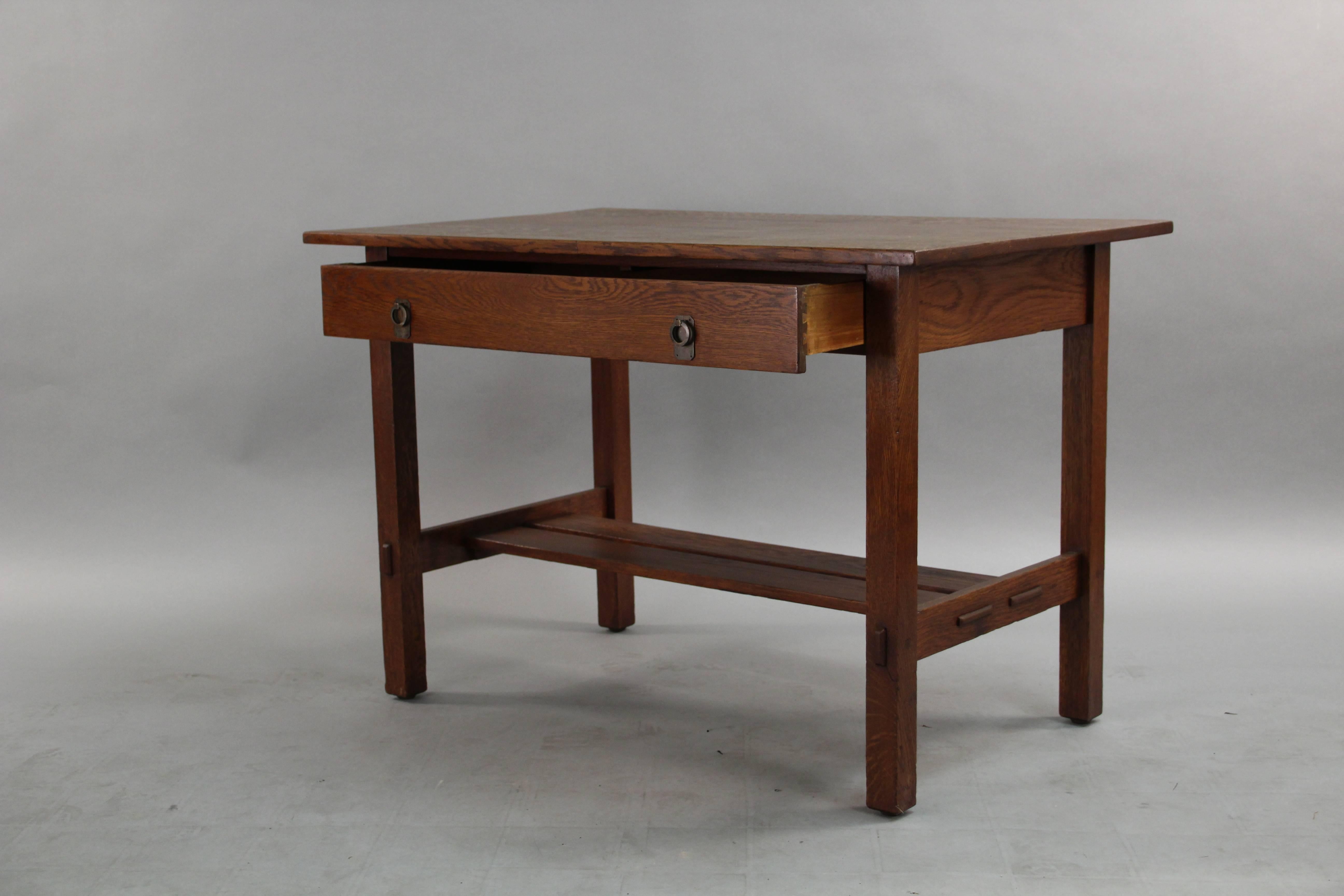 Oak Arts & Crafts desk with original Stickley Bros tag, one drawer with original pulls, circa 1910.