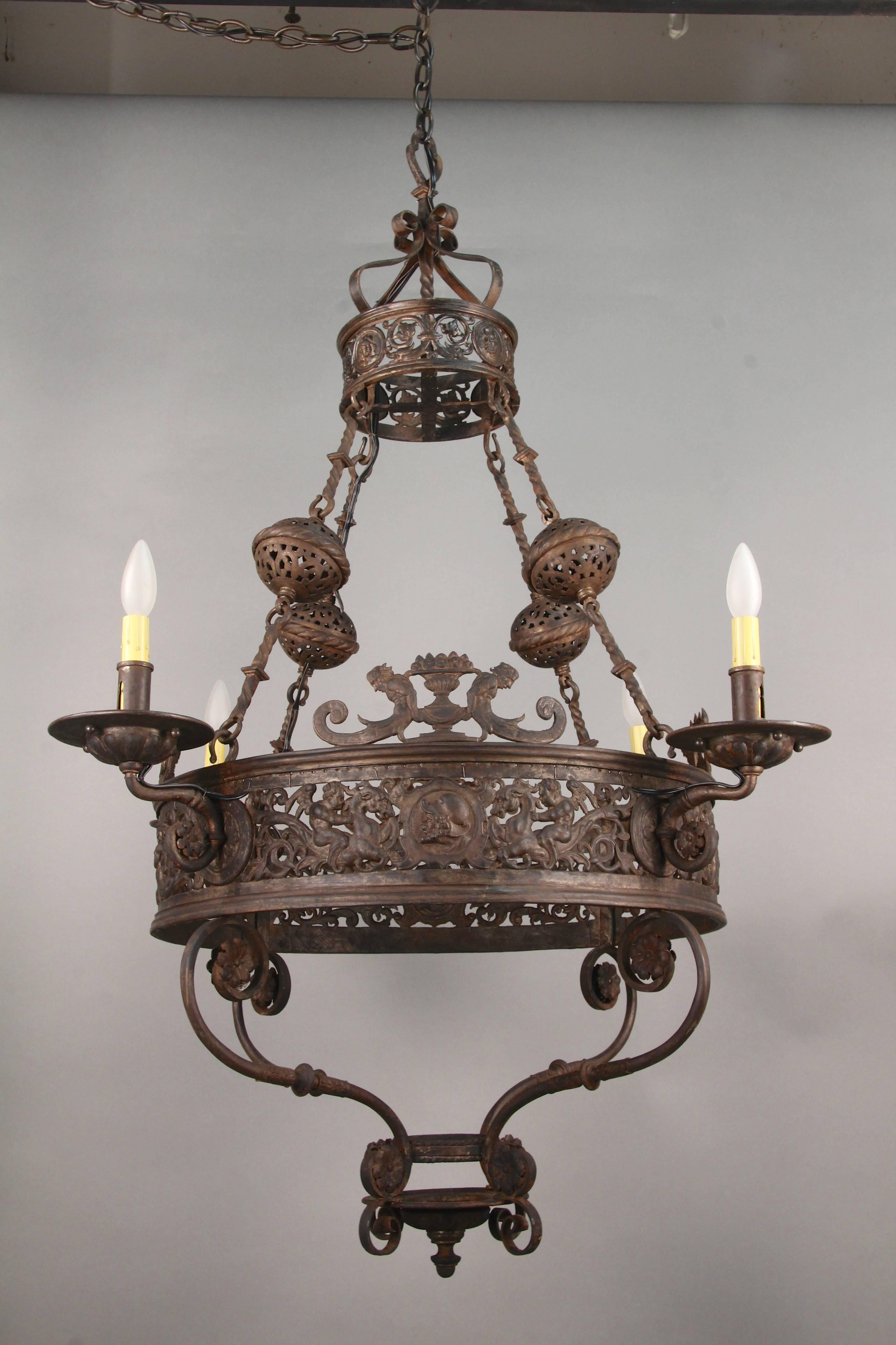 Impressive turn of the century large-scale 1920s chandelier with mythical figures. Incredible fine casting.