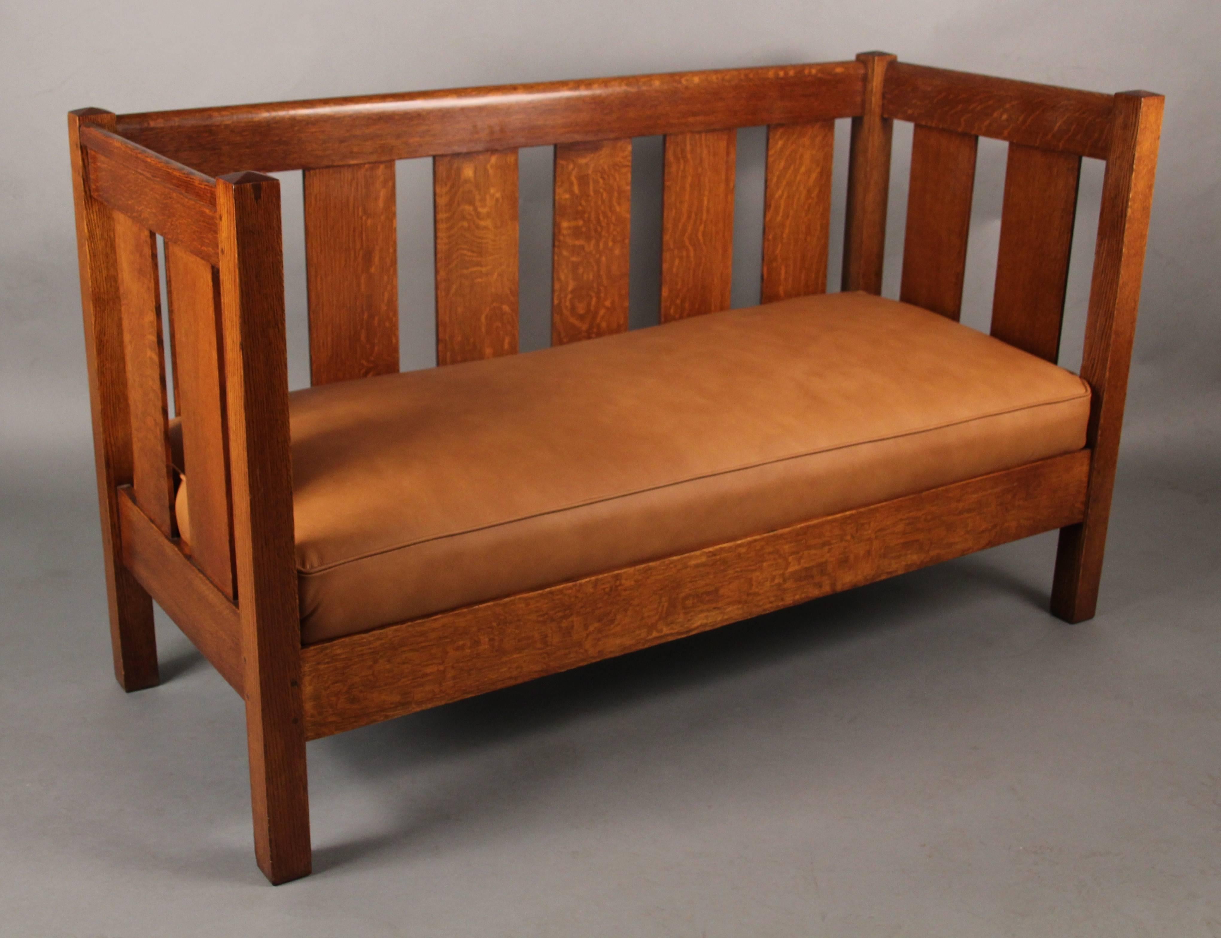 Classic Arts & Crafts settle recently upholstered in leather.