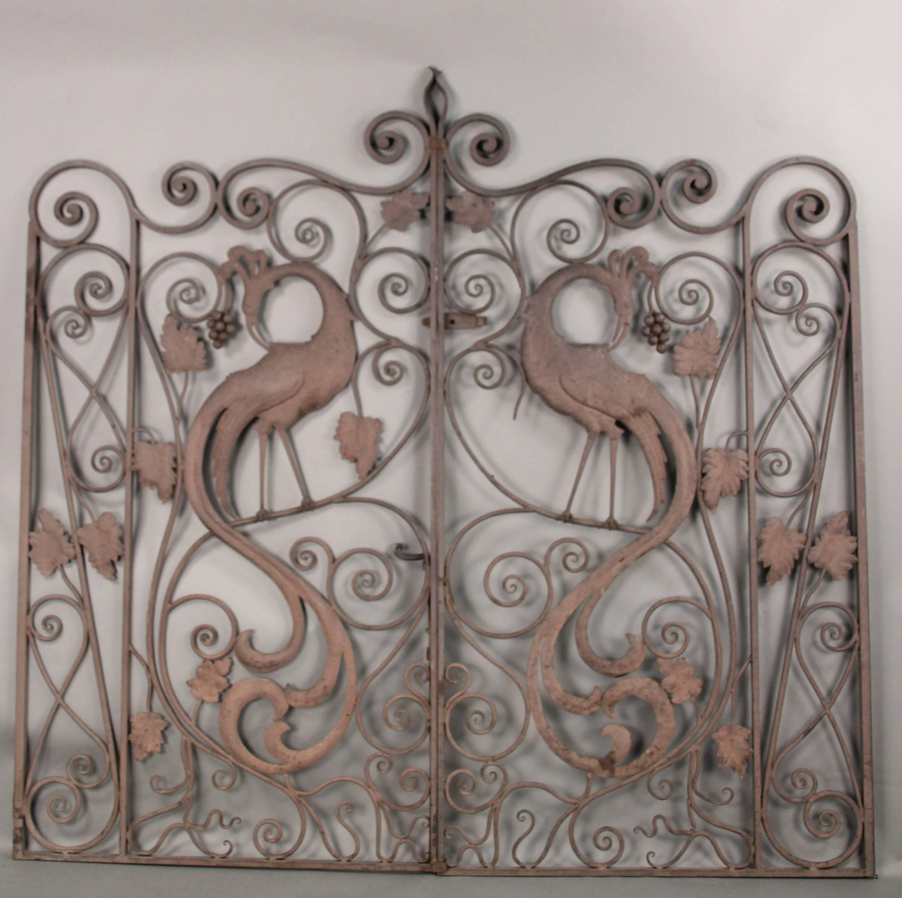 Pair of beautiful double gates with Peacock motif. These gates are late 20th century and were custom make for a local Los Angeles home.