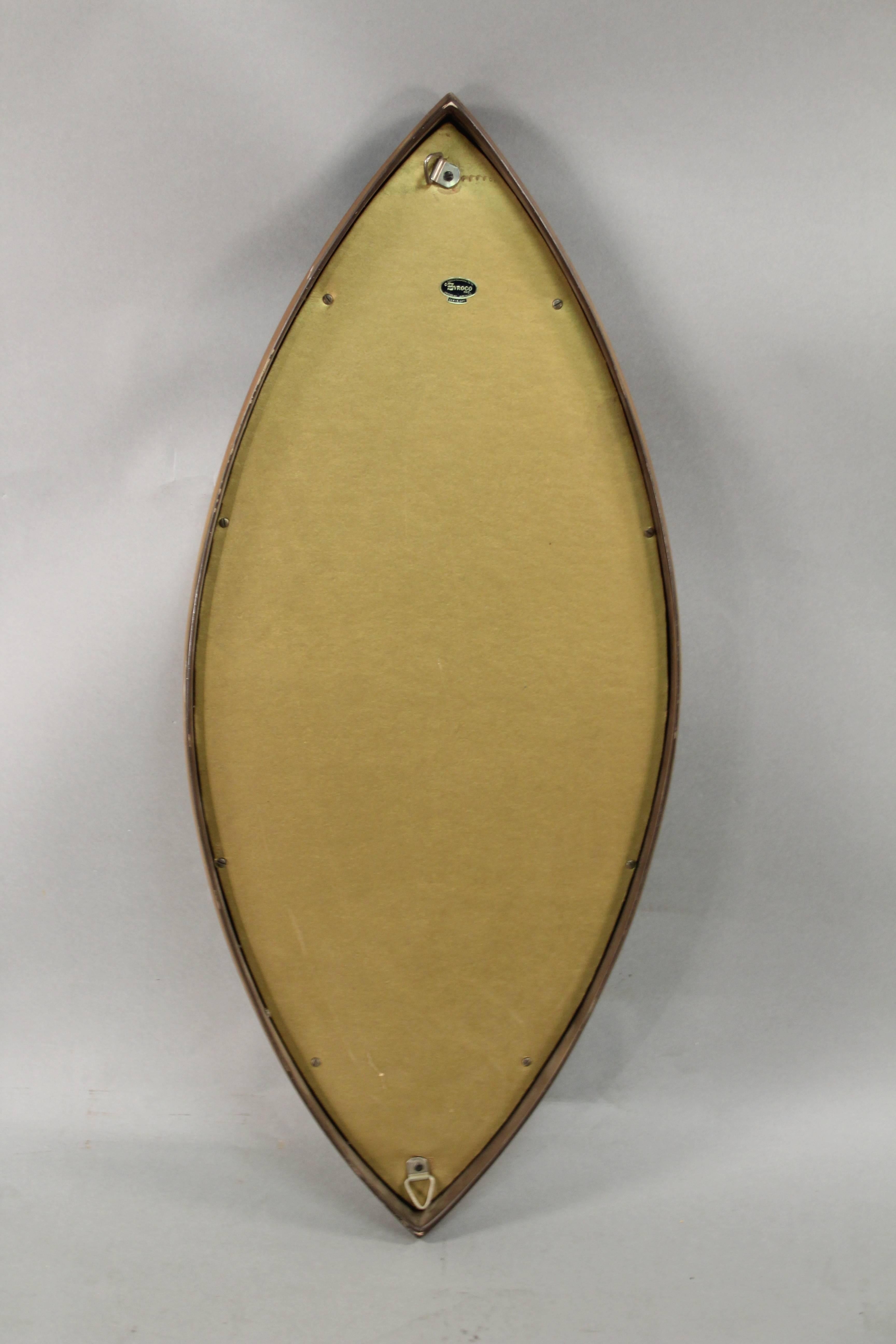 Wonderful designed modern mirror. Molded, synthetic wood made by the Syroco Co.