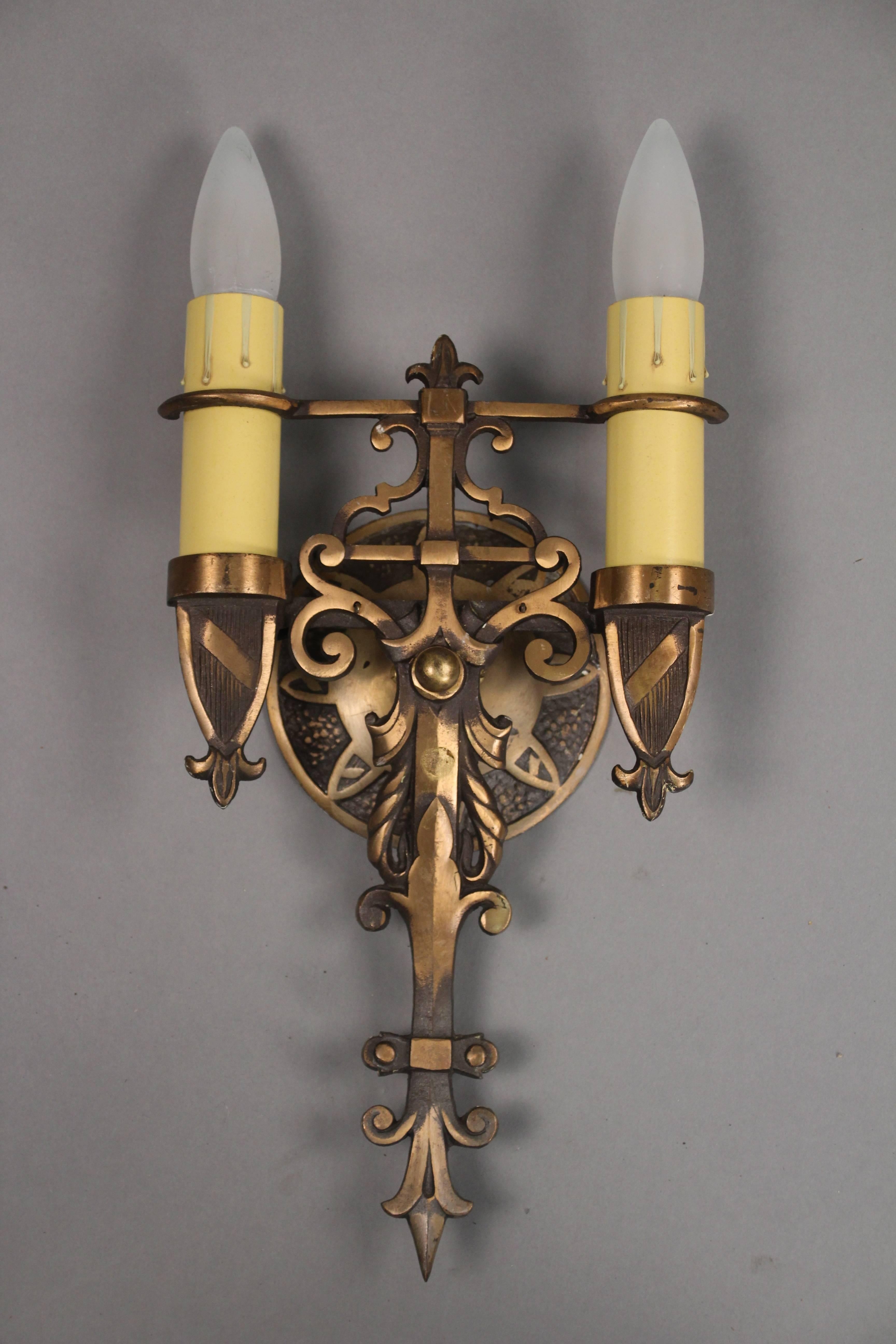 Pair of nice double sconces with shield motif, circa 1920s. Original finish.