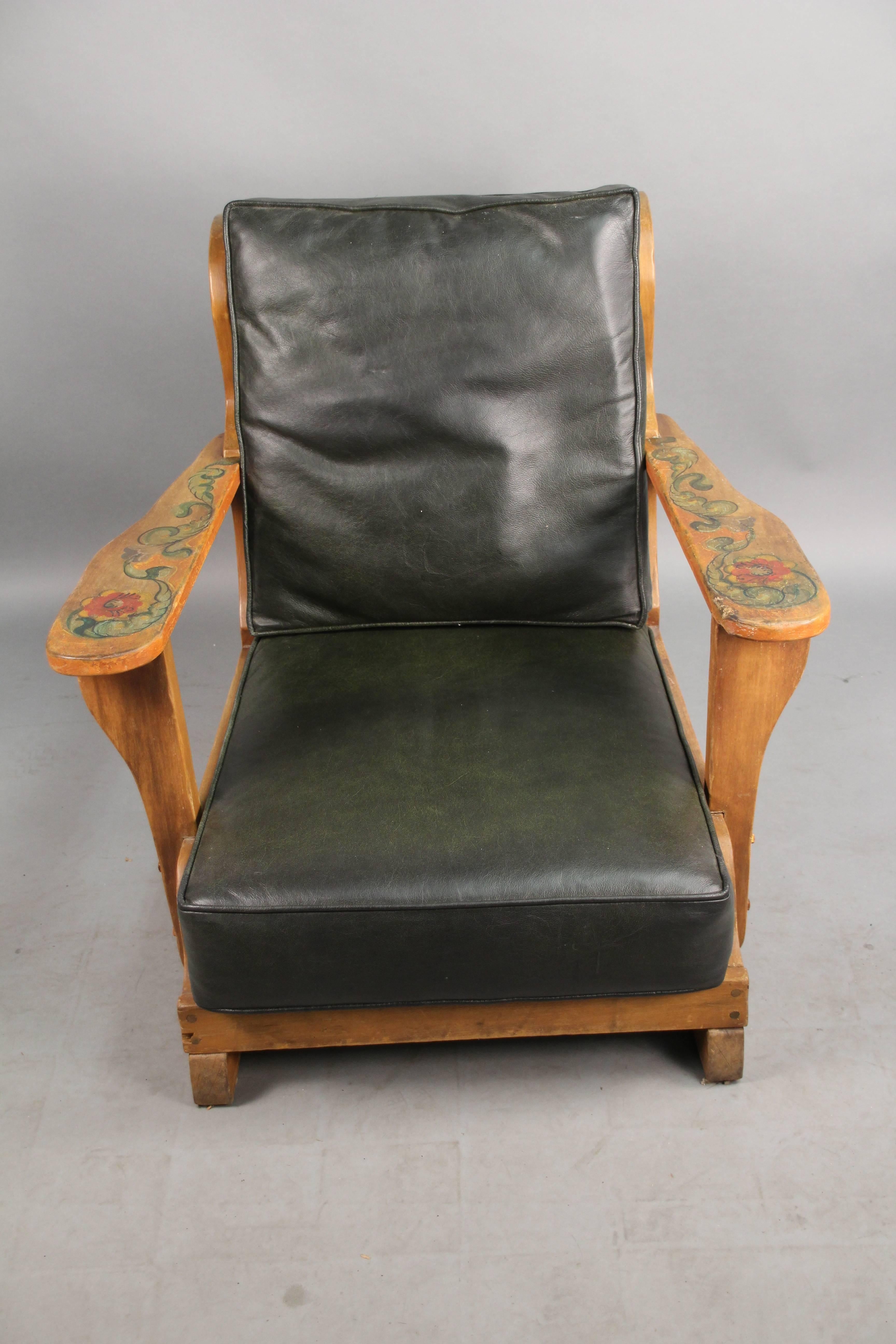 Armchair with painted flowers, circa 1930s. Signed. New leather upholstery.