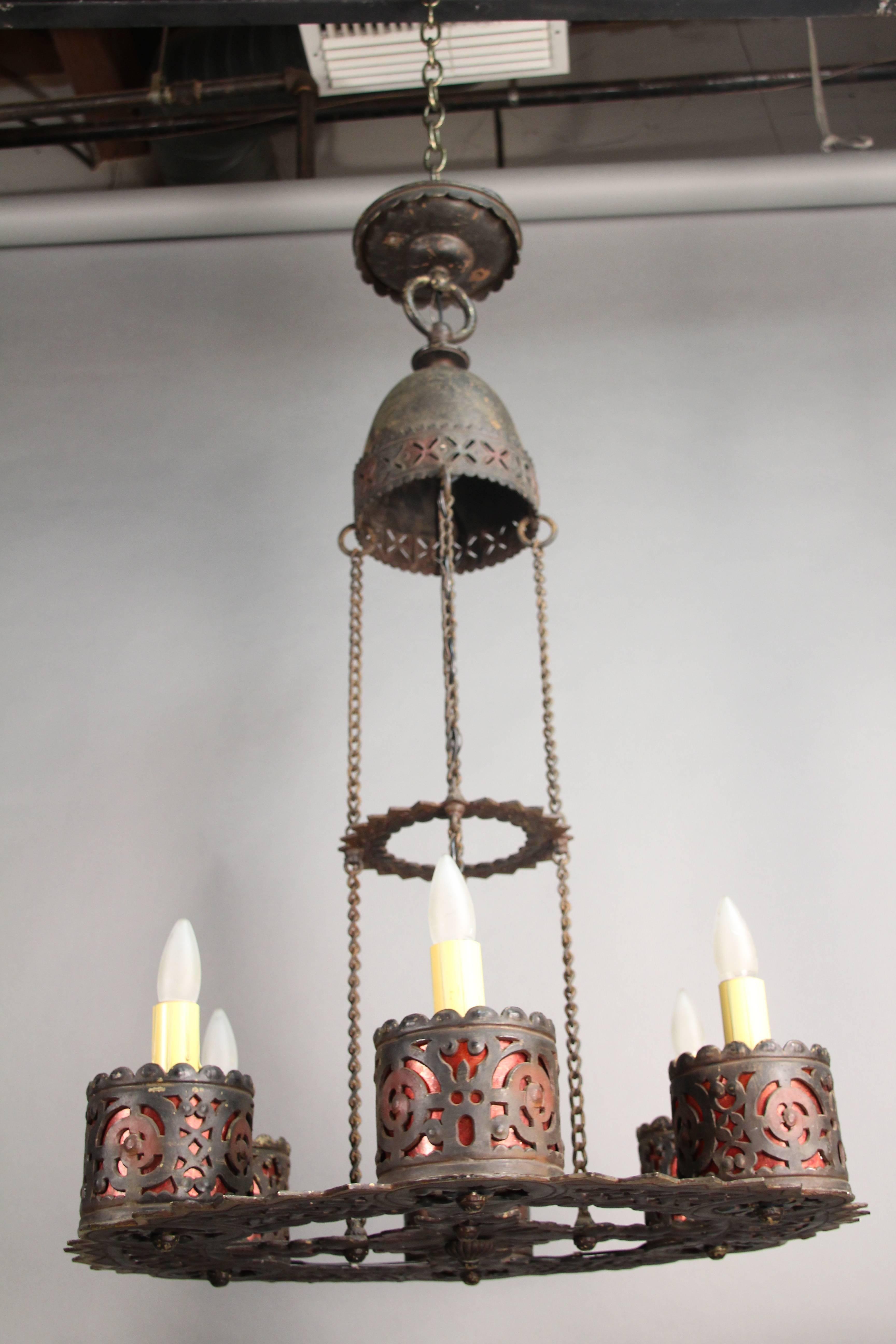 Great large-scale Spanish Revival 1920s chandelier with great metal work and intricate cut-outs. Original finish six lights
Measure: 41 1/8