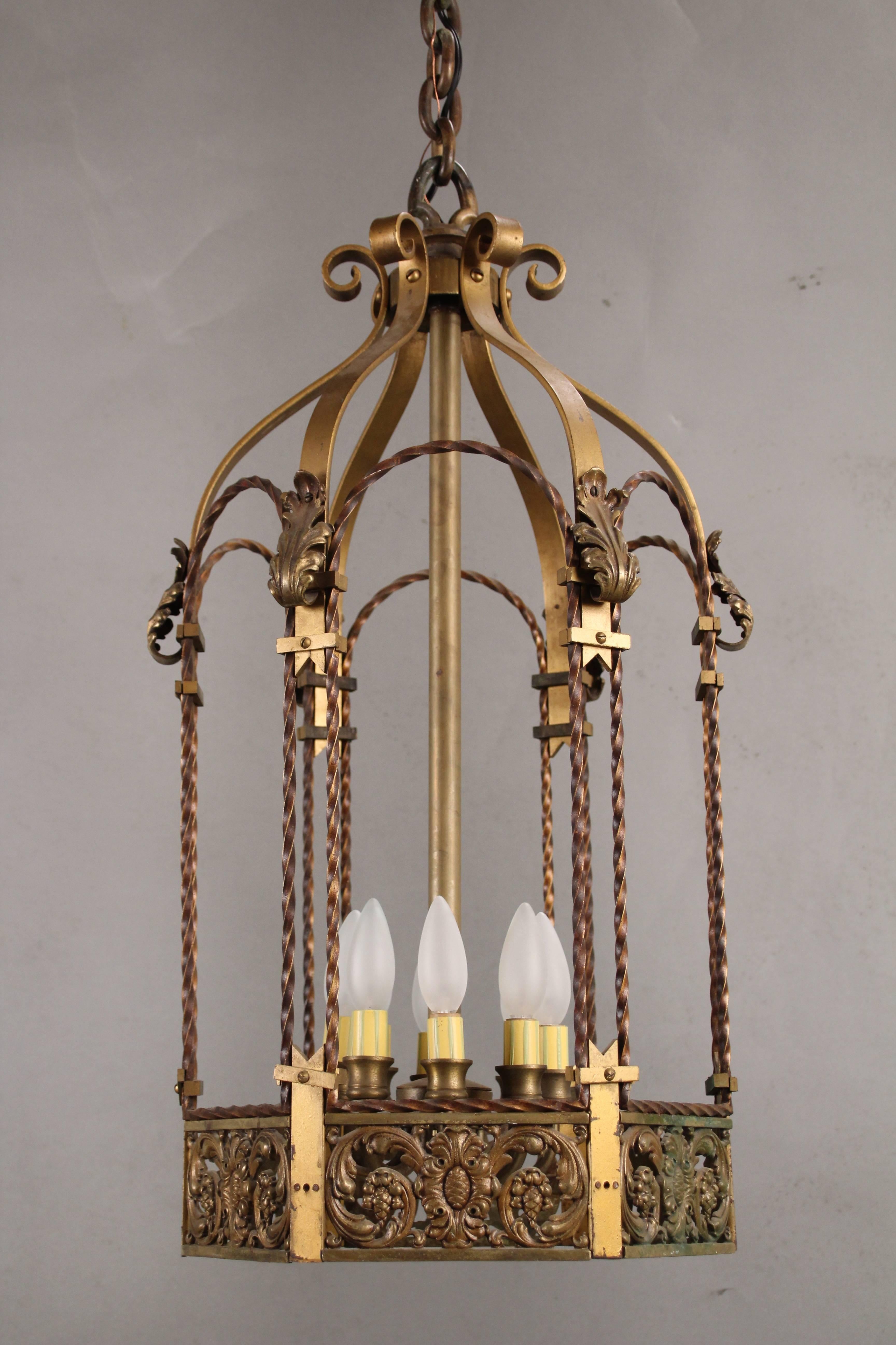 Wonderful 1920s pendant light with fine casting and original polychrome finish. Measures: 30