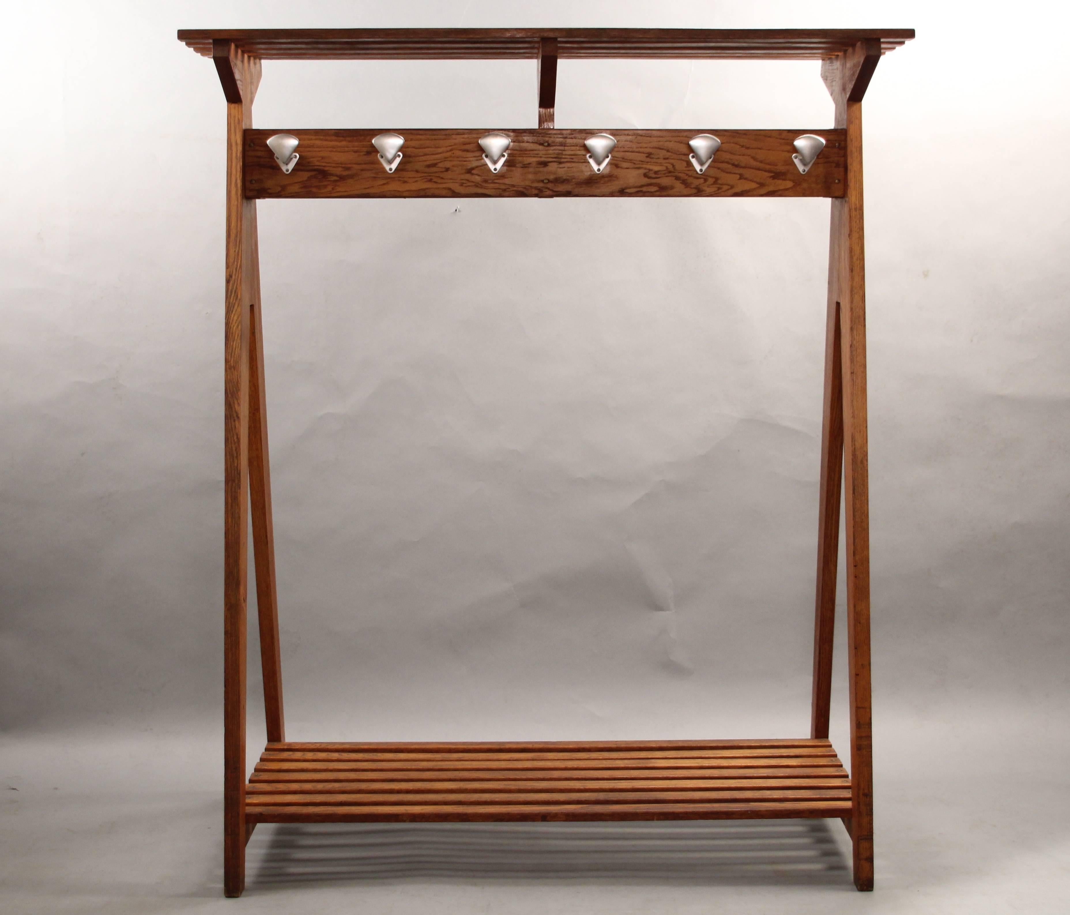 French coat rack, circa 1930s. Two sided. With slated top and bottom shelves. Measures: 70.5