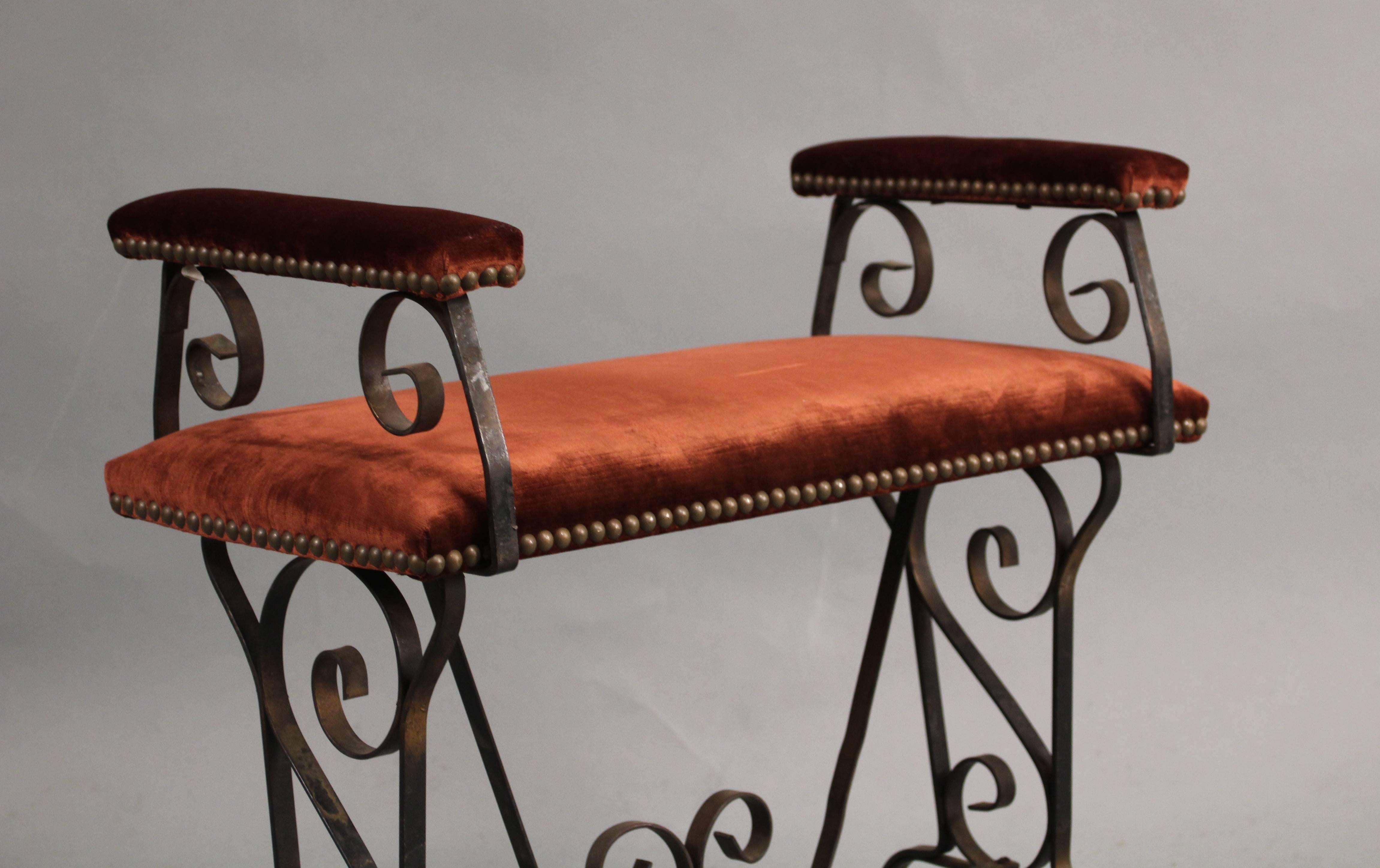 Delicate 1920s Spanish revival bench newly upholstered in velvet. Measures: 23.5