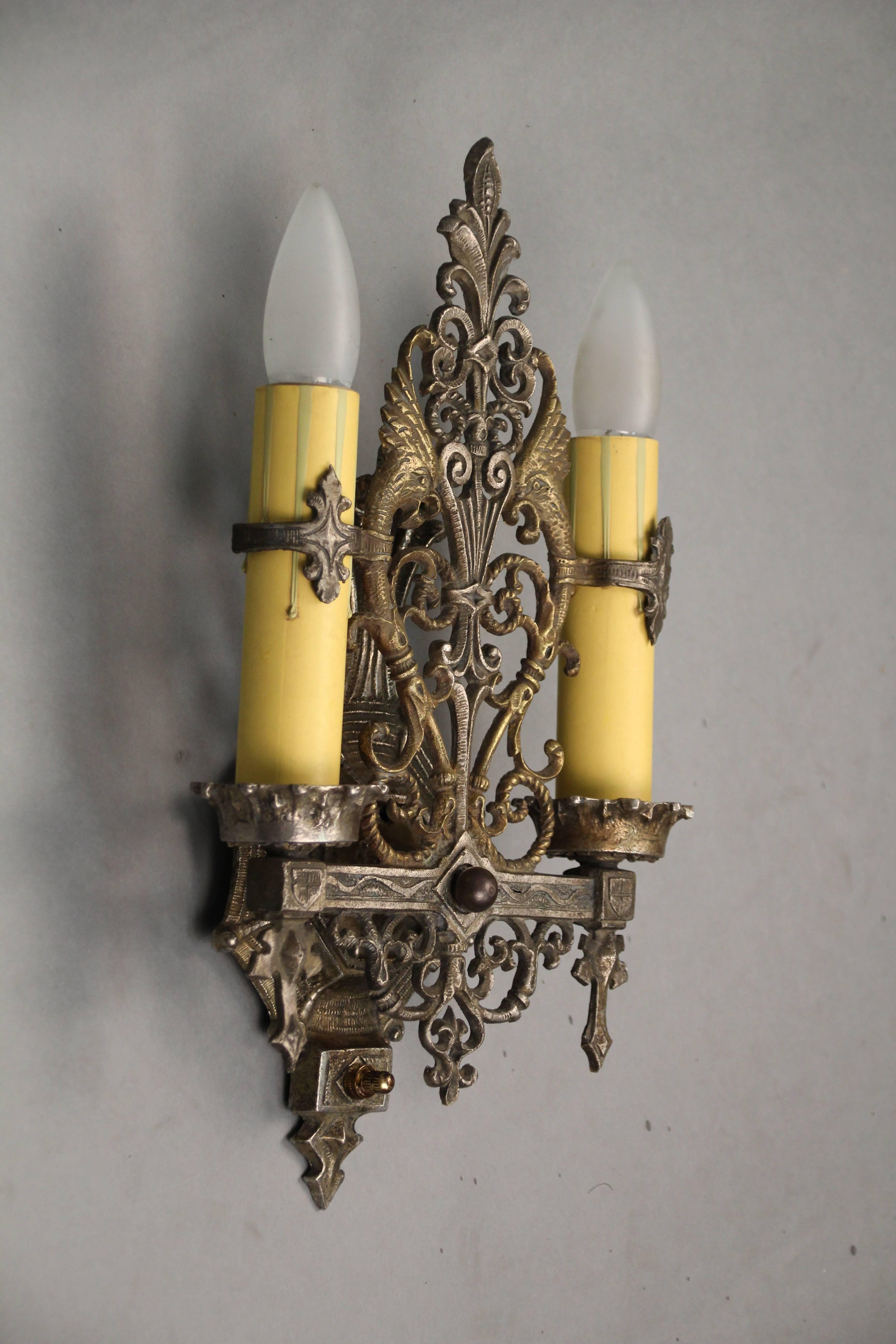 Attractive pair of double sconces with dragon motif, circa 1920s. Original finish.