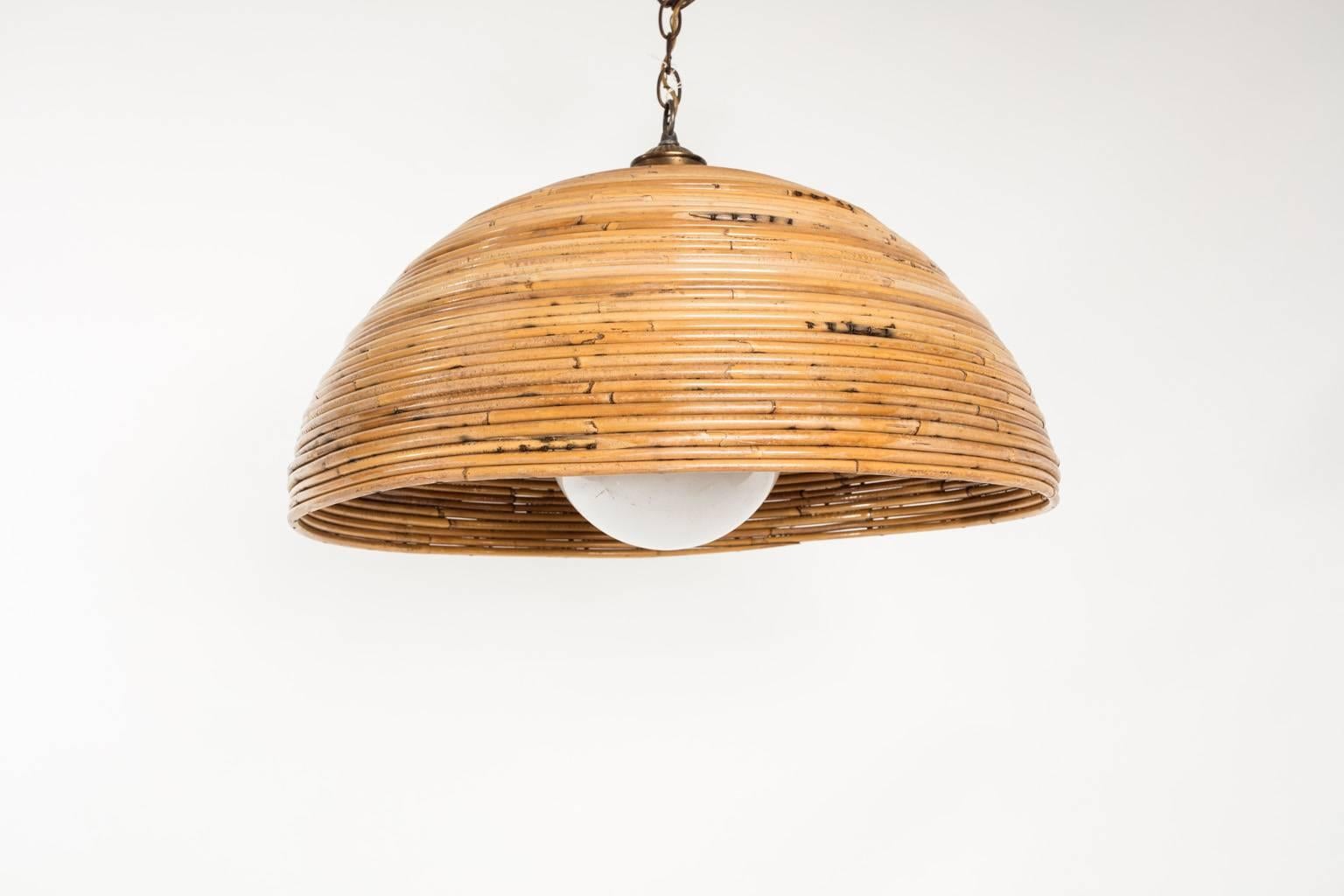 Hanging light fixture covered by a rattan, 