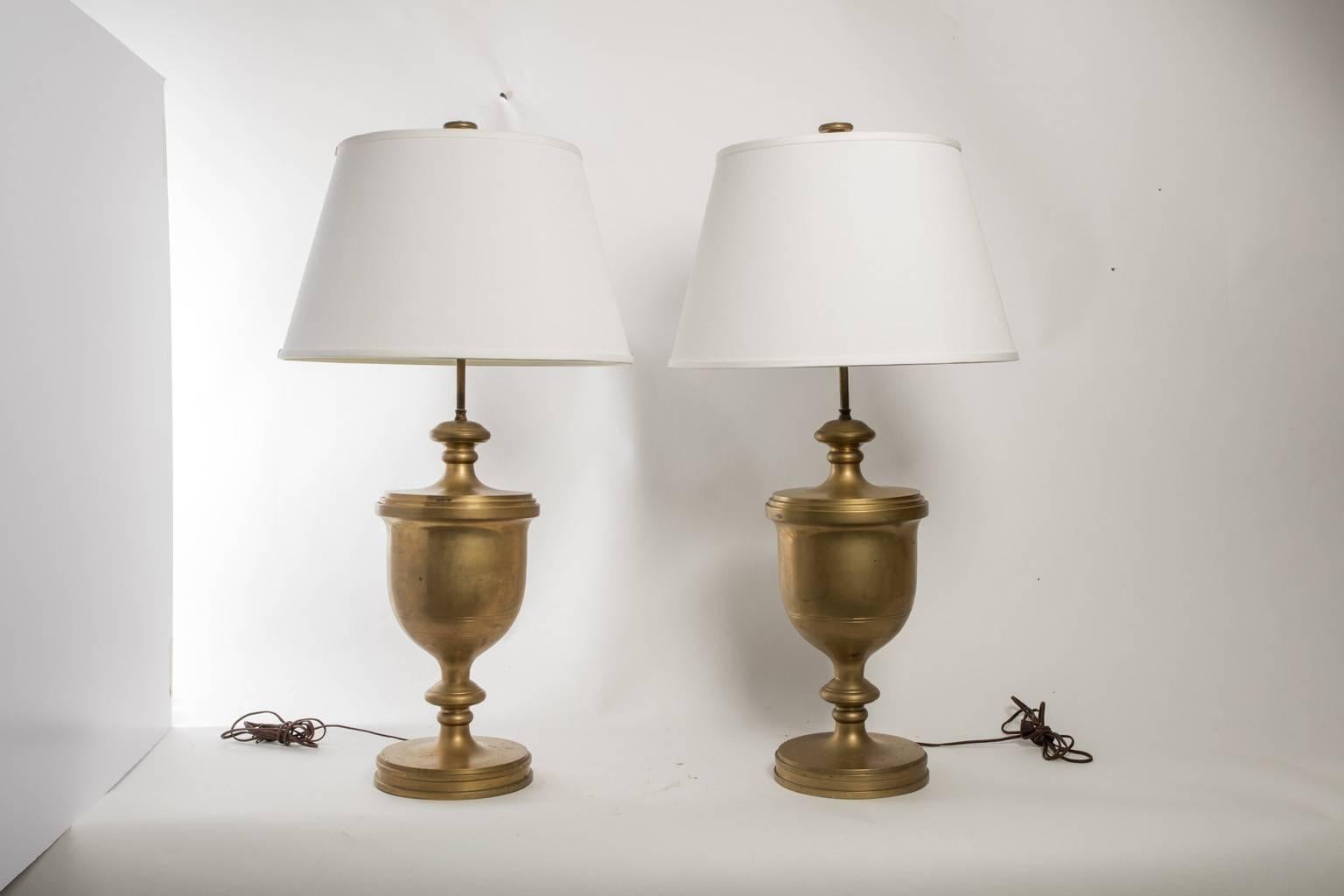 Pair of brass table lamps. Urn shaped. Signed.