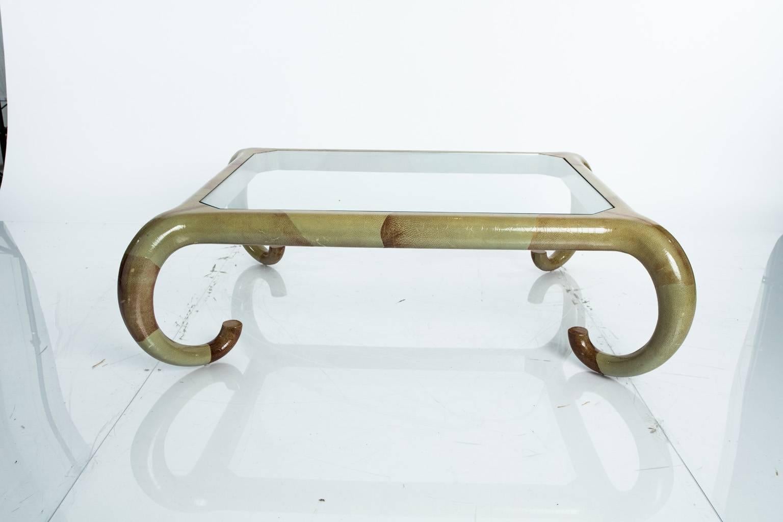 Mid-Century glass top coffee table with elephant shaped legs.