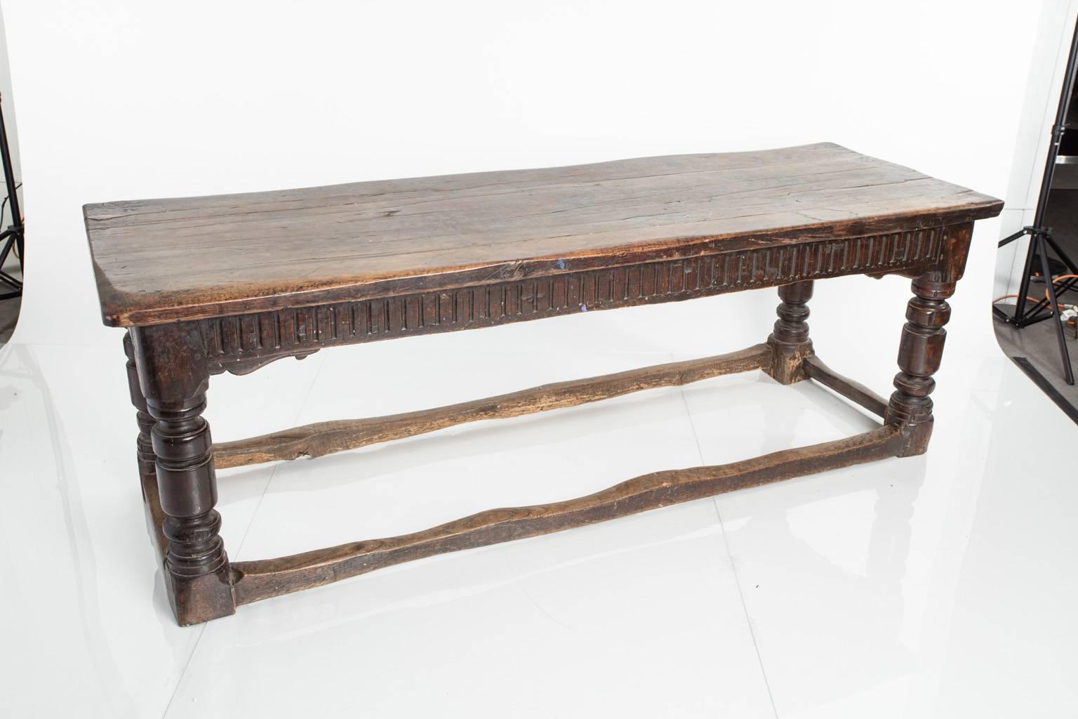 18th century Jacobean style trestle table, oak, with ring turned legs joined by a lower stretcher.