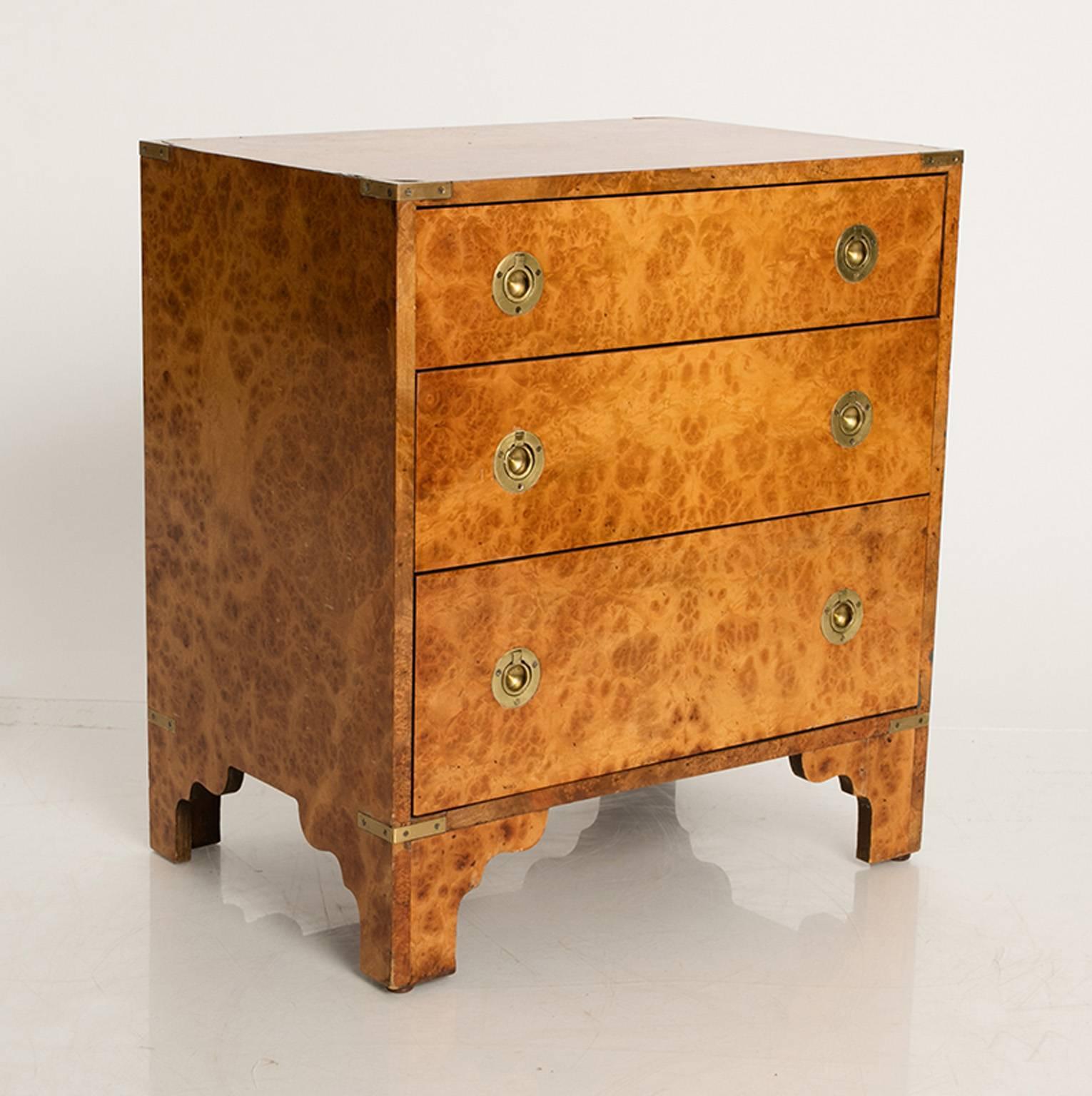 Three-drawer chest of drawers with inset ring pulls. Made from a pretty burl wood.