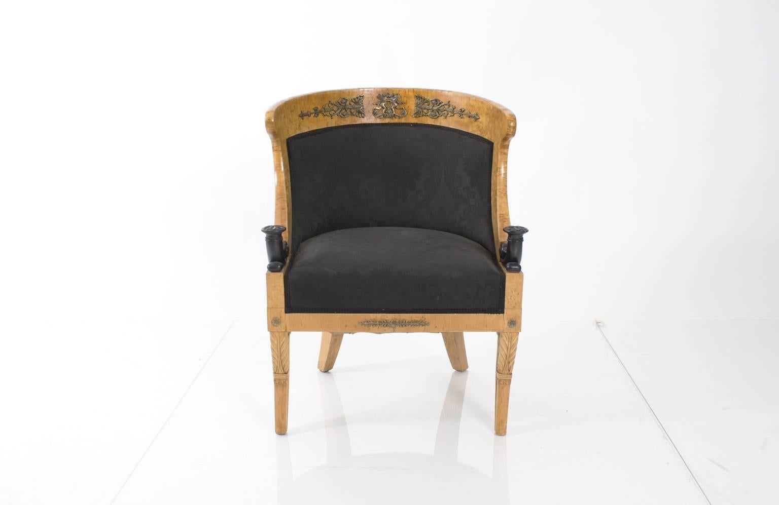 Pair of round-back Biedermeier armchairs. Neoclassical details such as decorative putti and palm frond details add to their overall elegance.
  