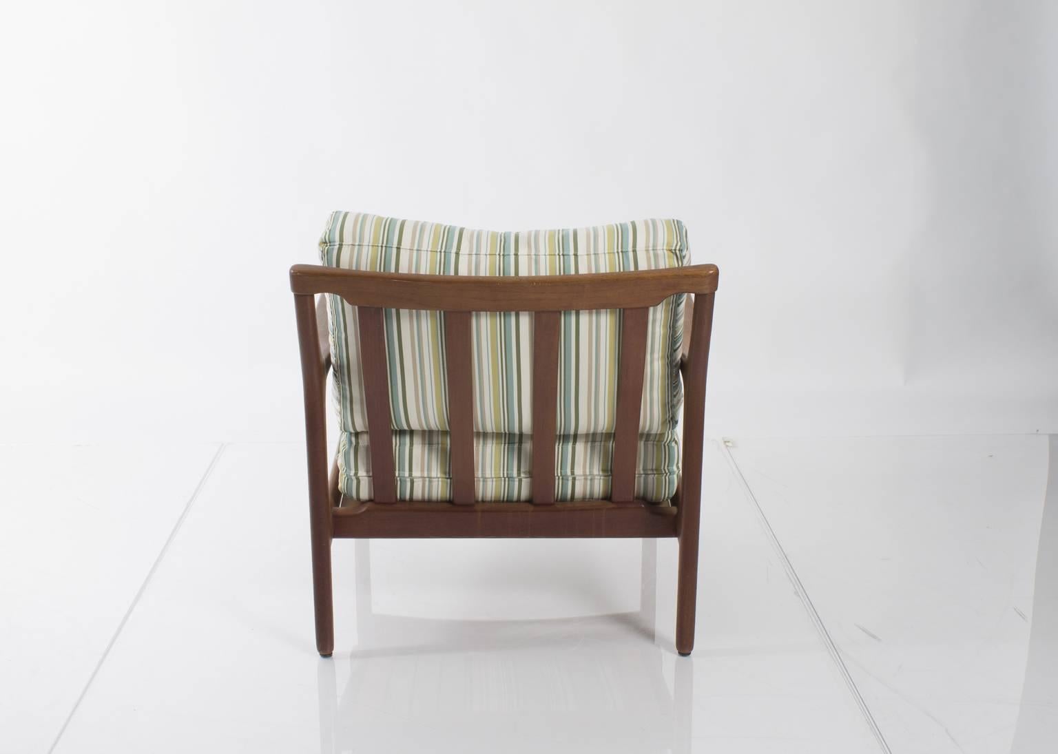 Pair of Mid-Century lounge chairs upholstered in striped fabric.
  