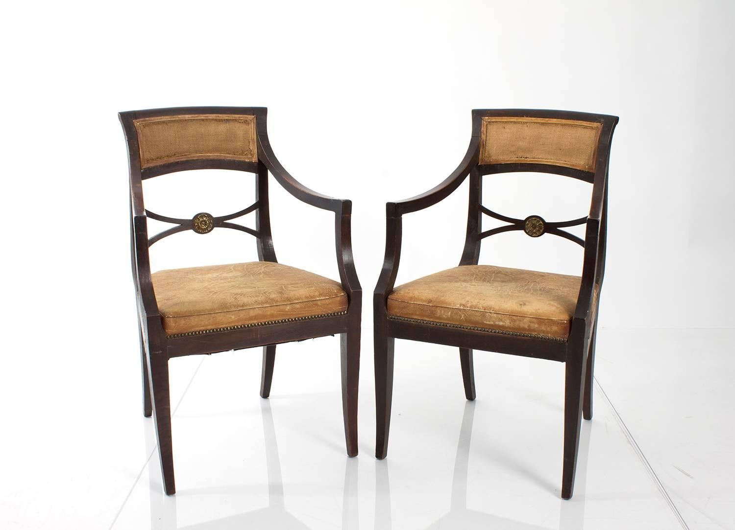 Pair of Regency style armchairs upholstered in distressed leather and burlap.
