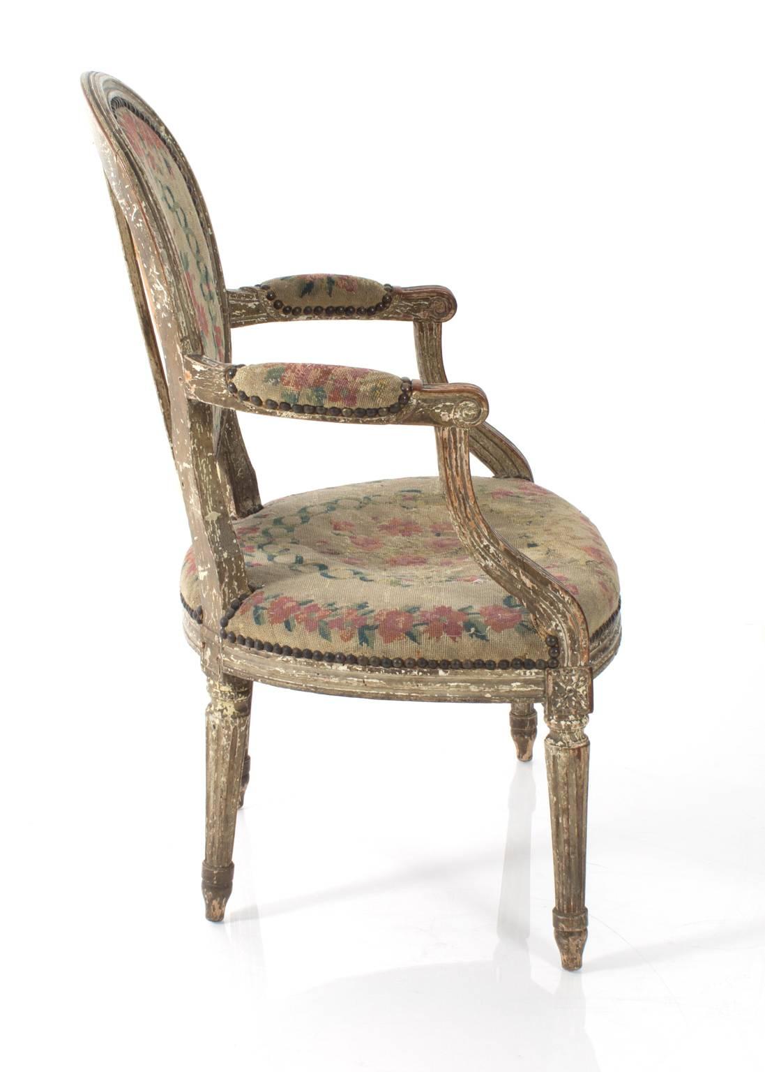 Louis XV style armchair, upholstered in a needlepoint fabric.
