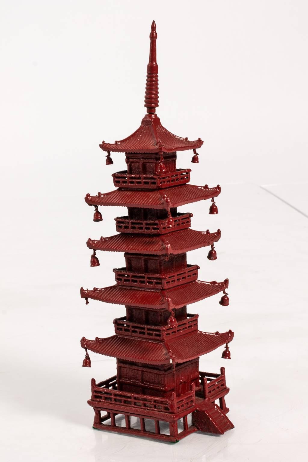 Vintage red iron pagoda ornament.