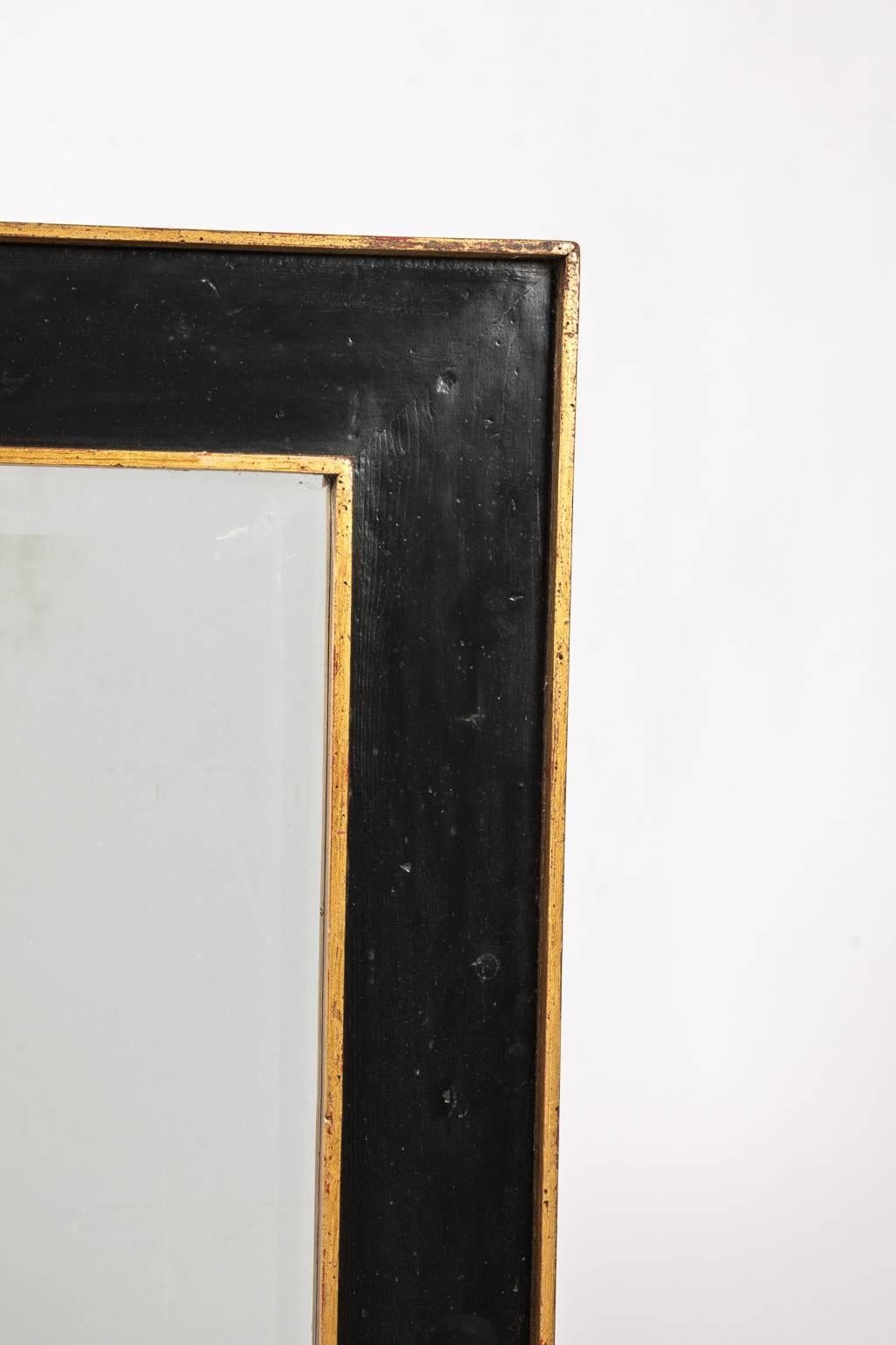 Beveled Black and Gold Framed Mirror For Sale