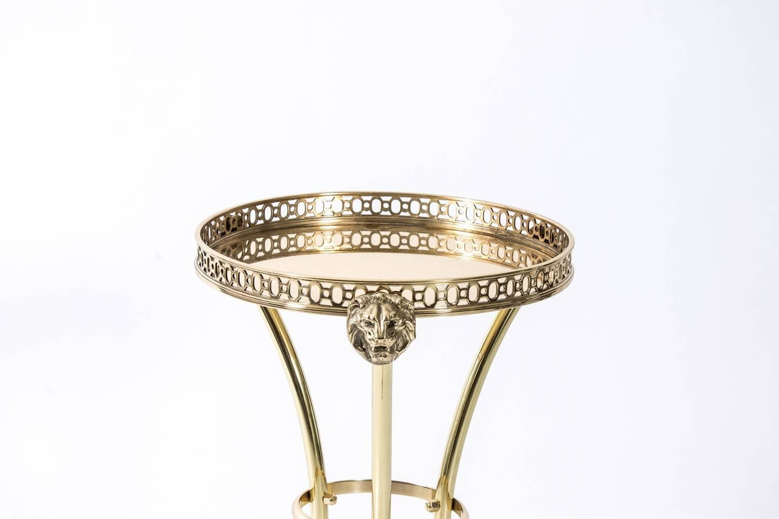 Brass lion's head drinks table with pierced gallery by Maitland-Smith.