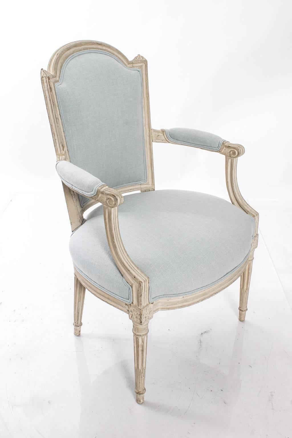 Pair of antique Louis XVI side chairs. Newly upholstered in blue linen fabric.