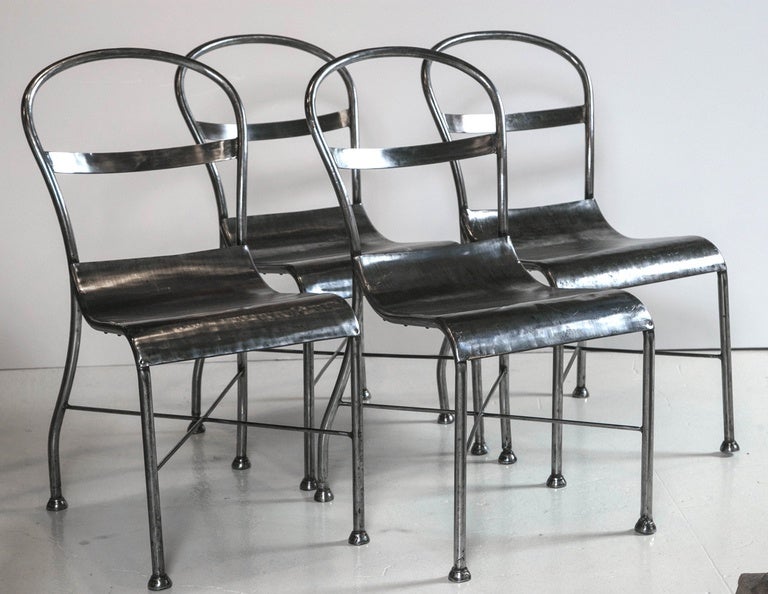 Rare set of four totally original French polished steel cafe/dinning chairs.