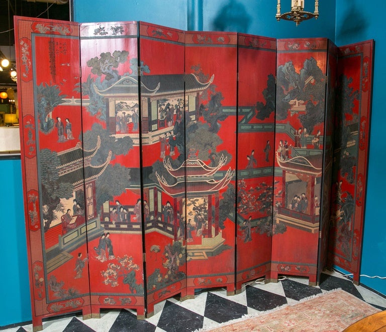 Eight-panel, red lacquer screen with hand-painted scene- people, tea houses, tress reverse floral and birds.

Purchased in Singapore.