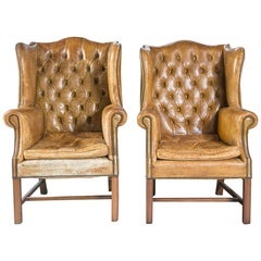Pair of Leather Tufted Back Wing Chairs
