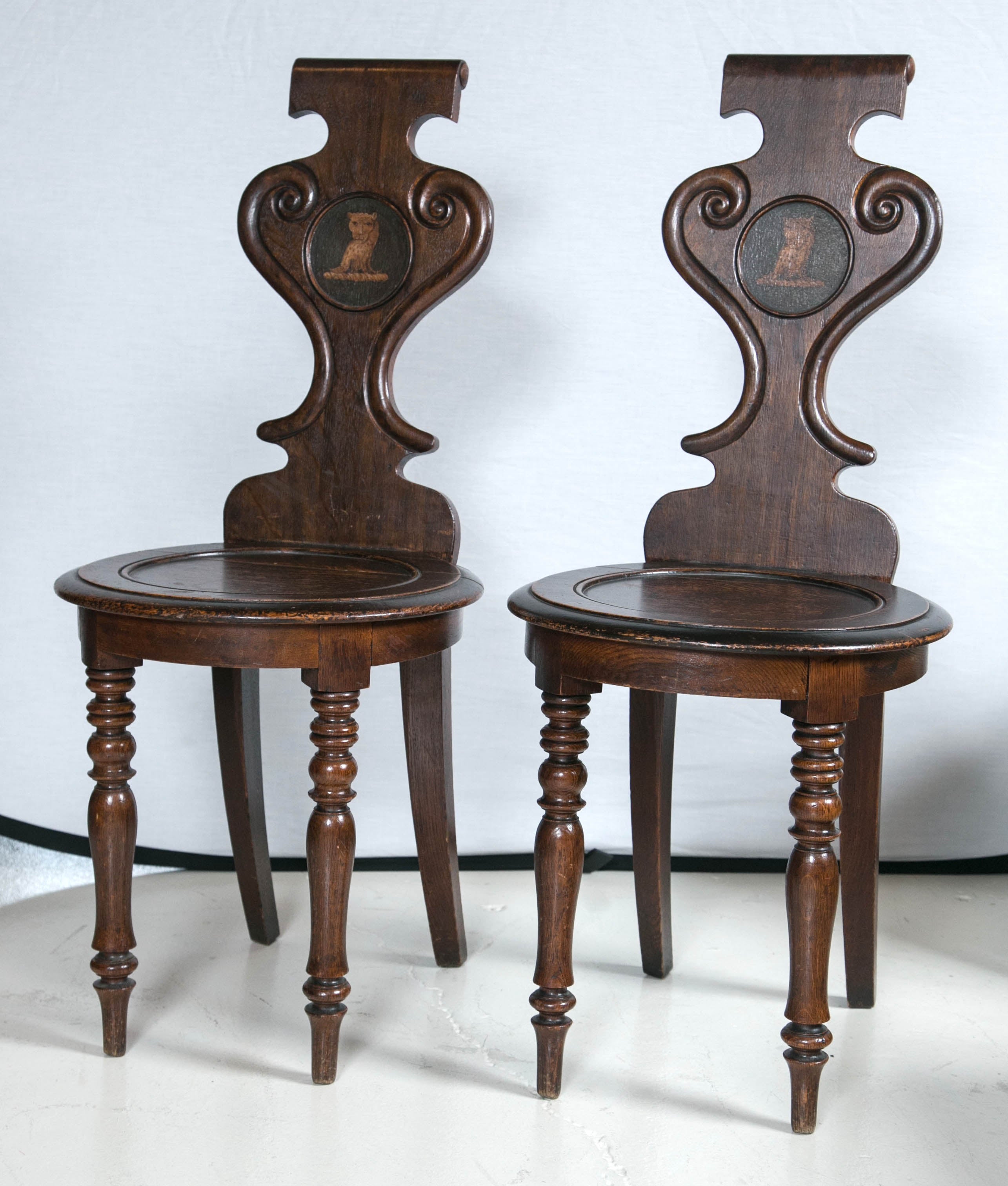 Pair of English Regency Oak Armorial Hall Chairs