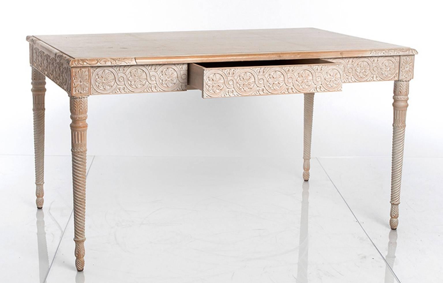 Swedish style table with a single drawer. The apron and corners are decorated with carved rosettes.
 