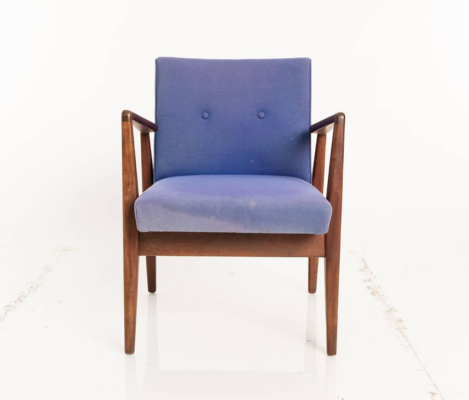 Pair of Mid-Century Modern teak open armchairs upholstered in a blue fabric.
