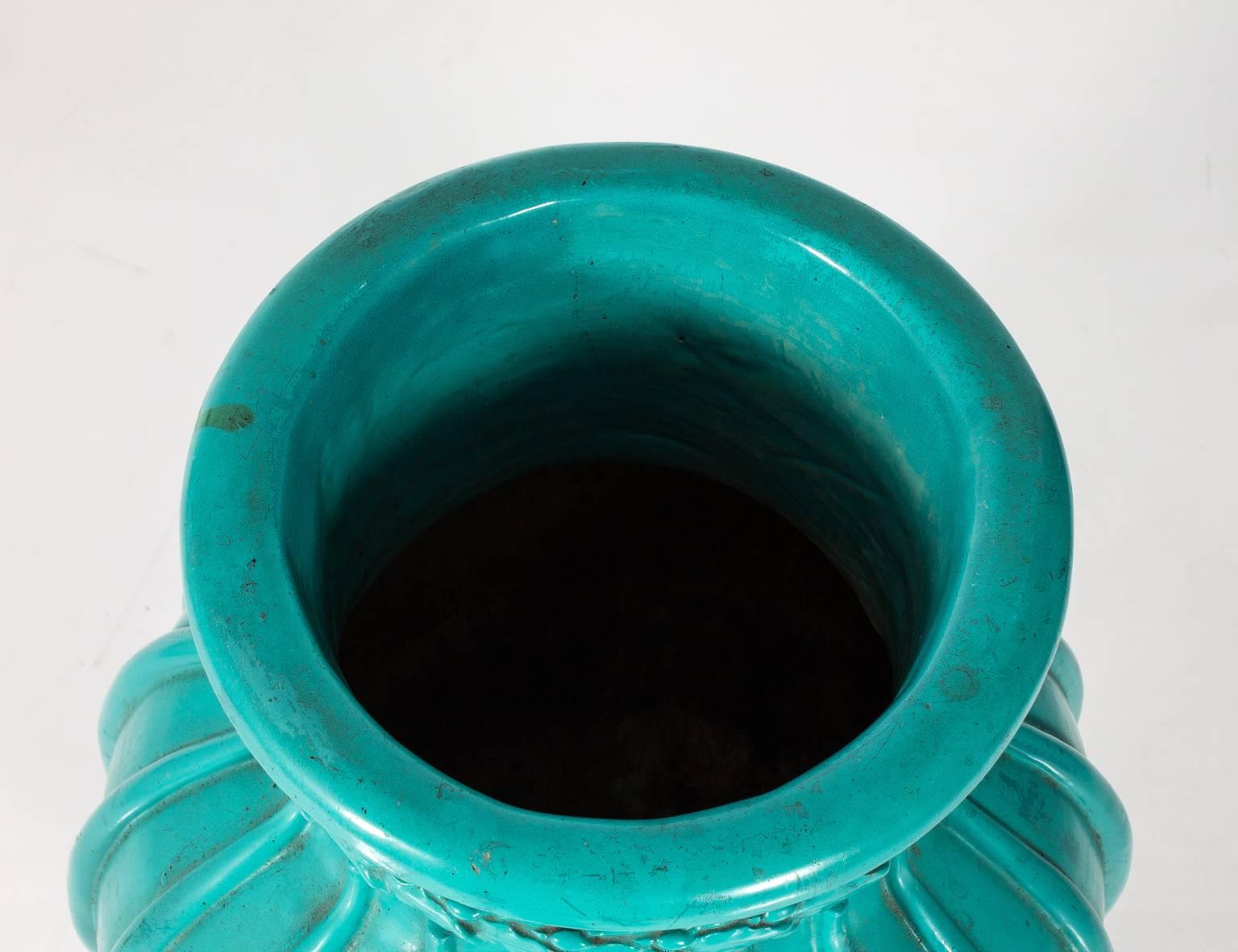 Substantial Majolica vase, dark turquoise. There are a few chips in this piece, but it still has character!