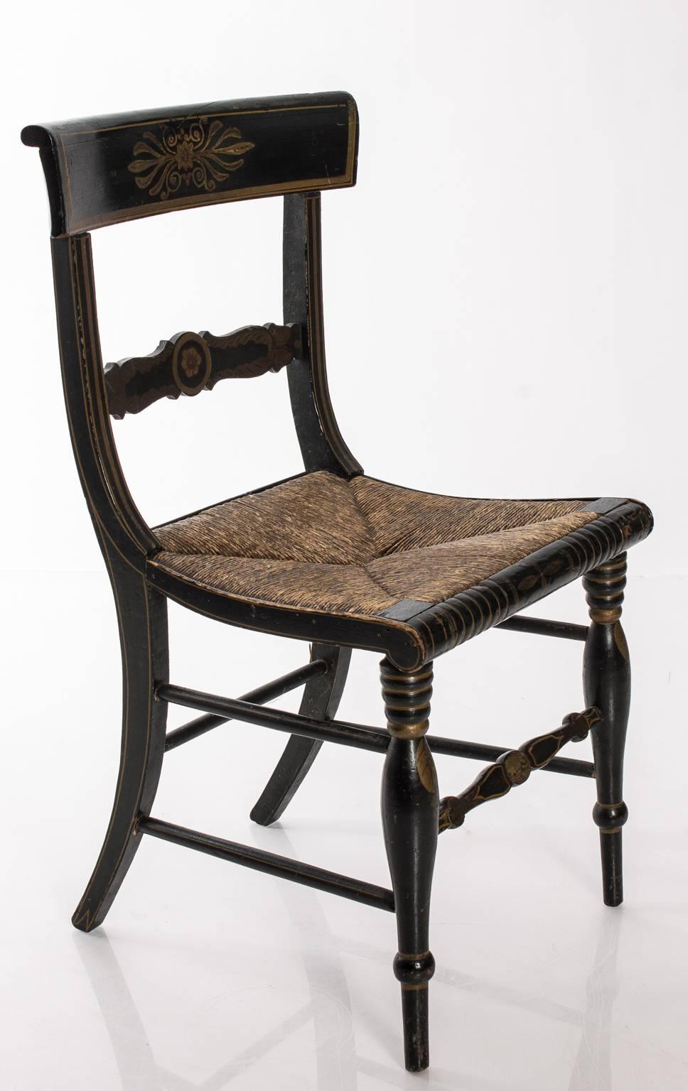 Painted Regency style side chair with original rush seat.