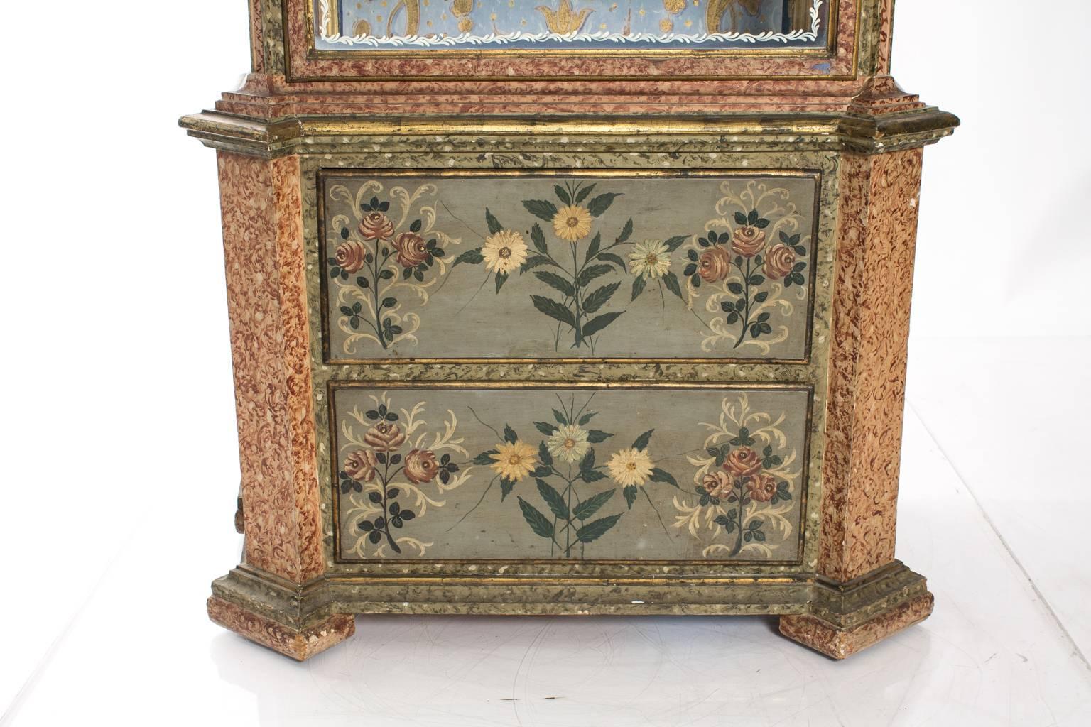 19th century Venetian decorated and glazed display cabinet, adorned with arched top and gilded carvings.