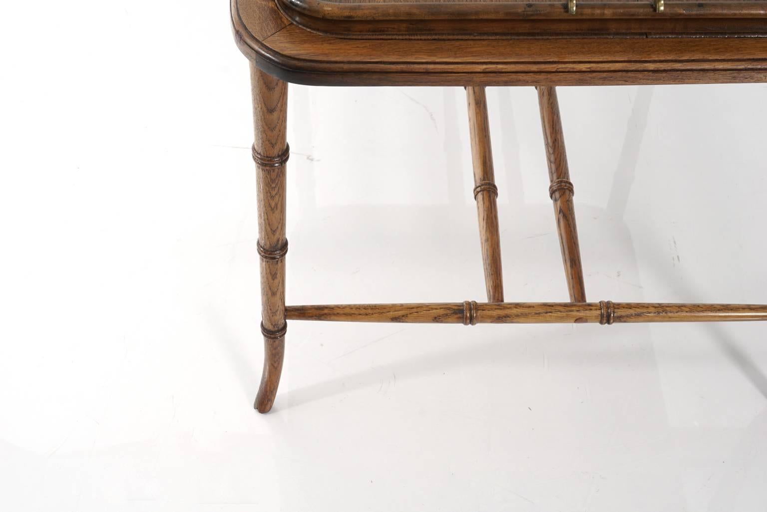 Faux bamboo English tray table with brass handles, circa 1950s. Tray is removable.