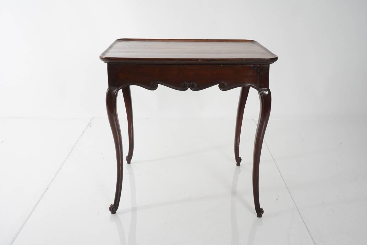 French mahogany, single drawer tea table with scalloped apron and cabriole legs, circa 1800s.
