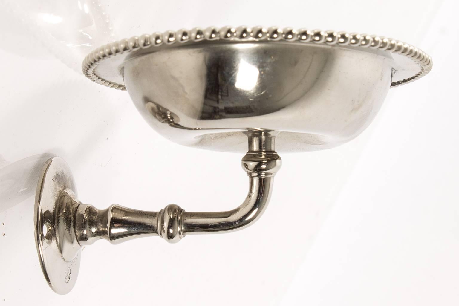 Beaded metal wall-mounted soap dish holder.