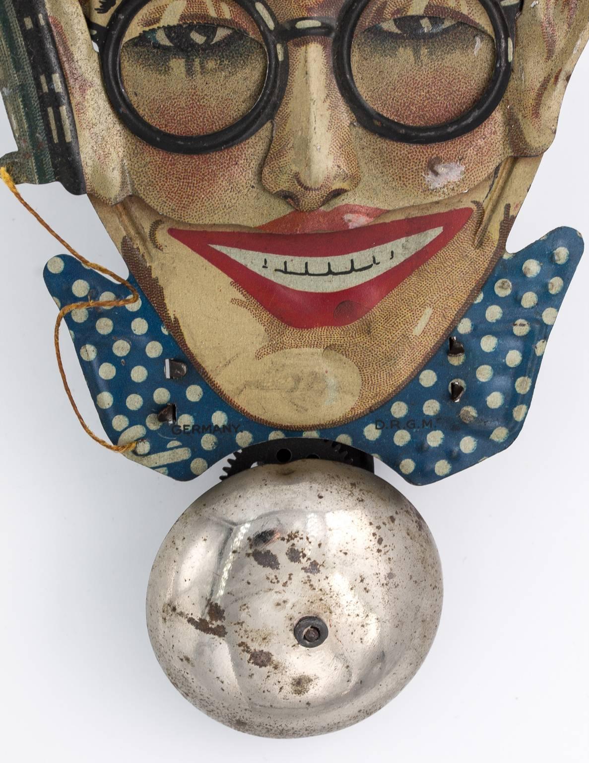 1920s Harold Lloyd litho tin toy. Working and paint is in good condition, though bell has some rust spots.