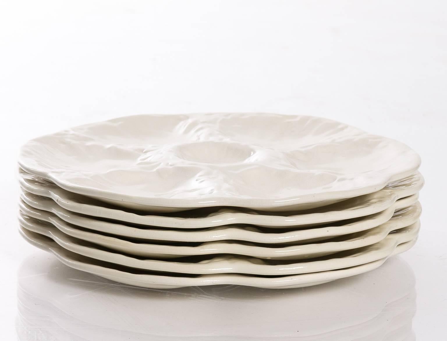 Set of six oyster plates. Bottom stamp reads, 