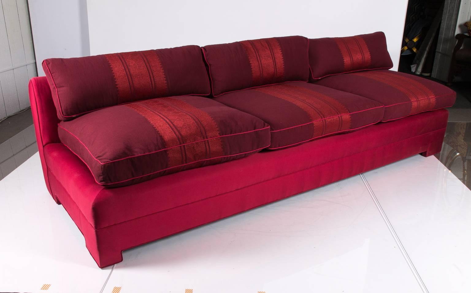 Contemporary design sofa upholstered frame and cushions with deep seating.