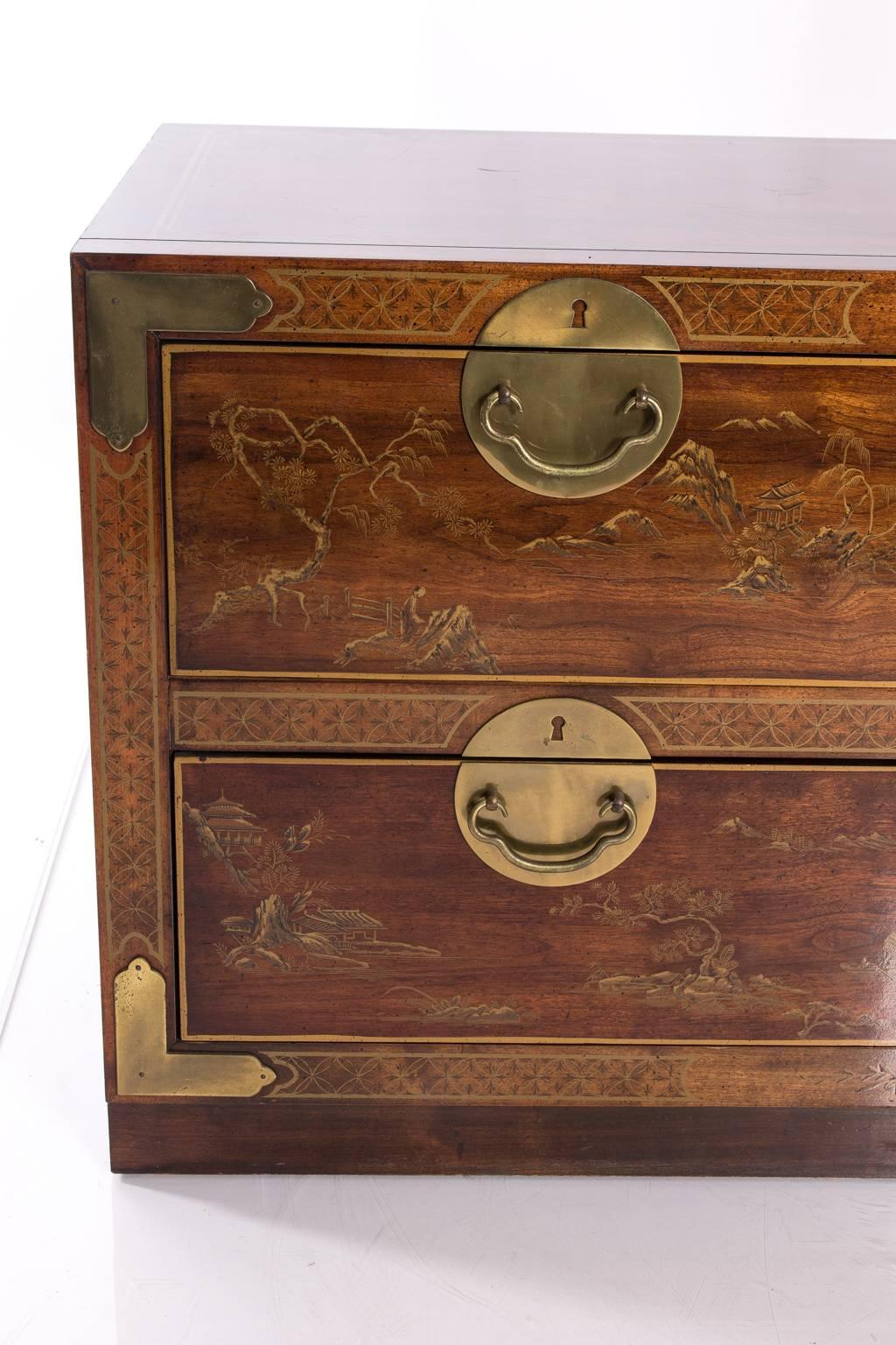 Two-drawer chinoiserie low chest with brass hardware. Several minor scratches on the side.