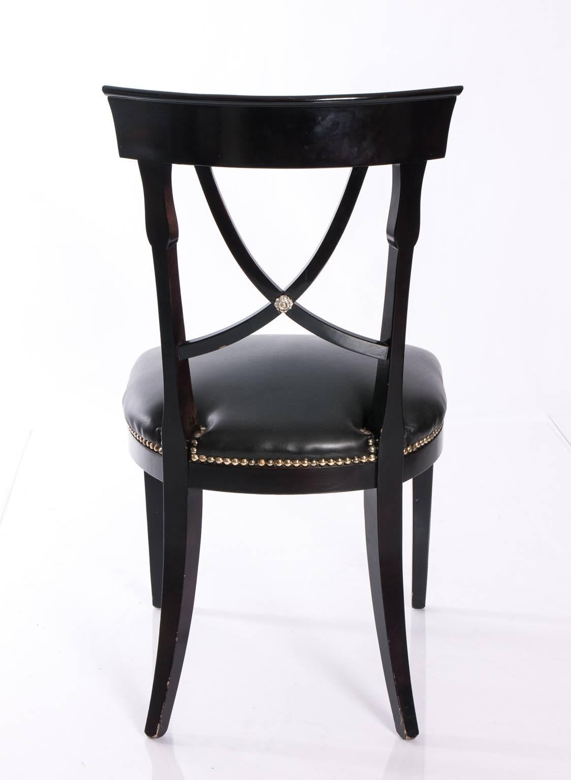 Regency style chair with ebonized wood and leather seat, and gold nailheads. Great as a desk chair or side chair.